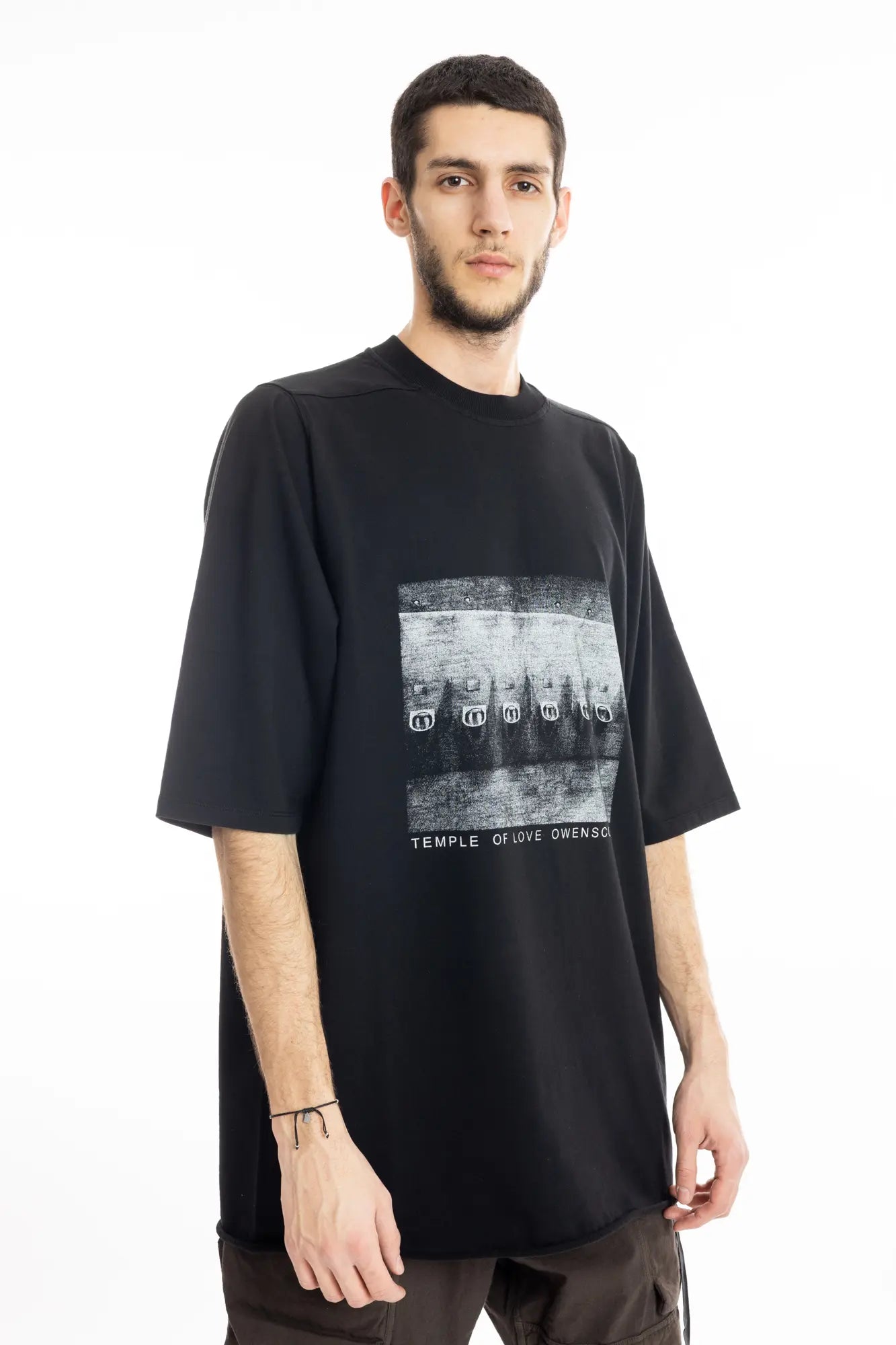 Rick Owens DRKSHDW Mens  T-Shirt , Jumbo Short Sleeve T-Shirt , Oversized Fit , Ribbed Crewneck , Below Hip Lenght , Elbow Lenght Short Sleeves , Signature Front Level Shoulder Seams , Temple of Love OWENSCORP Print , Black Heavy Cotton , Organic Cotton , Side Angle Photo