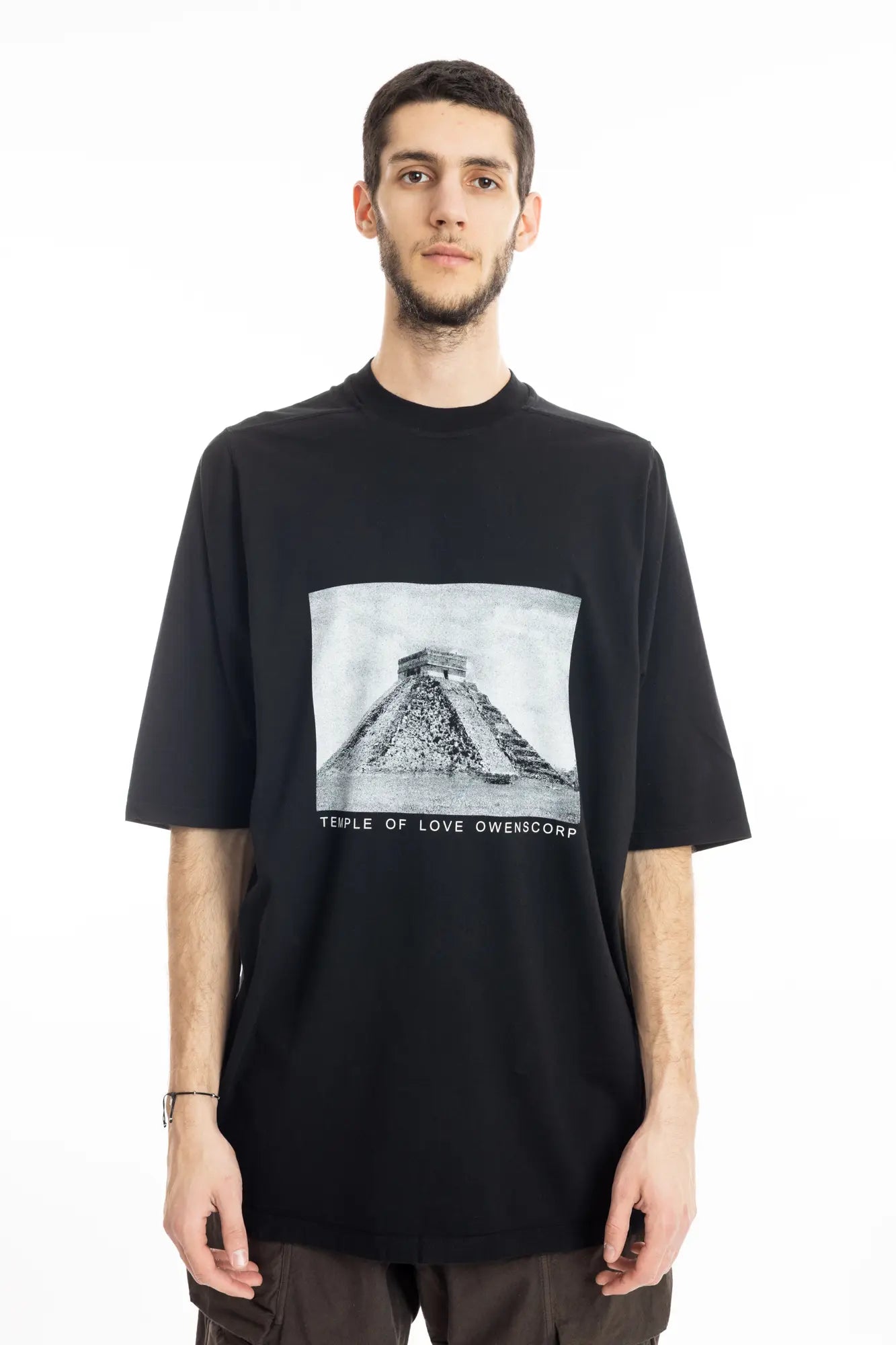 Rick Owens DRKSHDW Mens  T-Shirt , Jumbo Short Sleeve T-Shirt , Pyramid Graphic Print On Front  , Oversized Fit , Ribbed Crewneck , Below Hip Lenght , Elbow Lenght Short Sleeves , Signature Front Level Shoulder Seams , Temple of Love OWENSCORP Print , Black Heavy Cotton , Organic Cotton , Half Body Photo