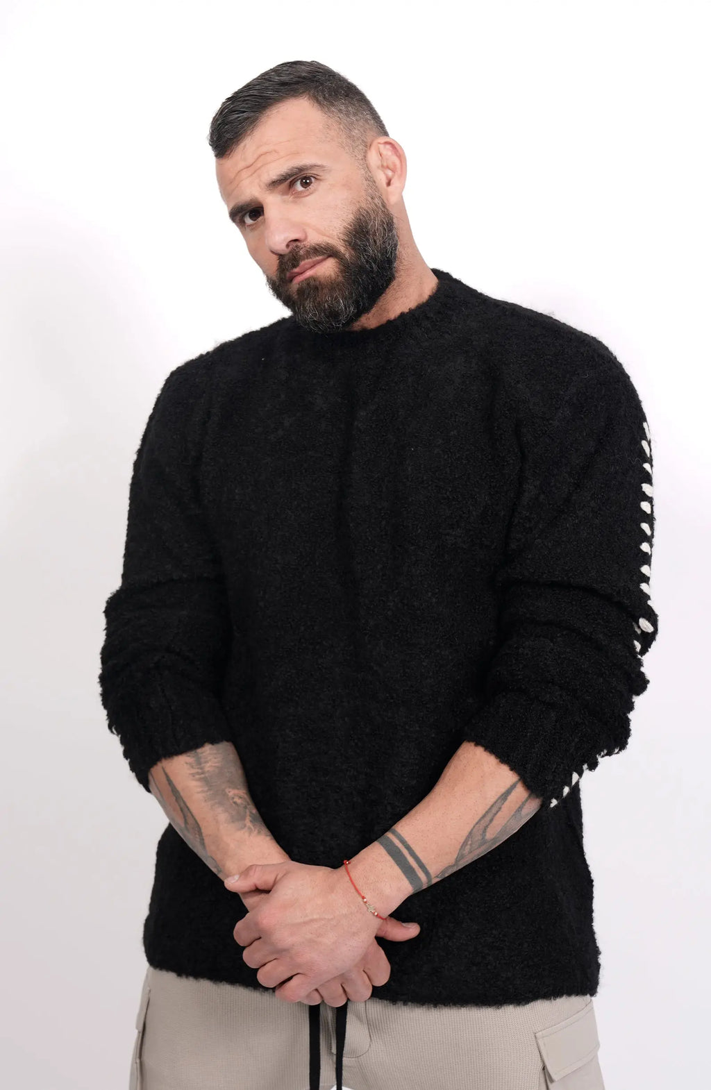 Thom Krom, Mens Sweater, Black, Contrasting White Details, Cross White Stitching, Alpaca Wool, Polyamide, M K 117, Thermal, Warm, Heating, Long Sleeves, Breathable, Front Portrait Crossed Hands. 