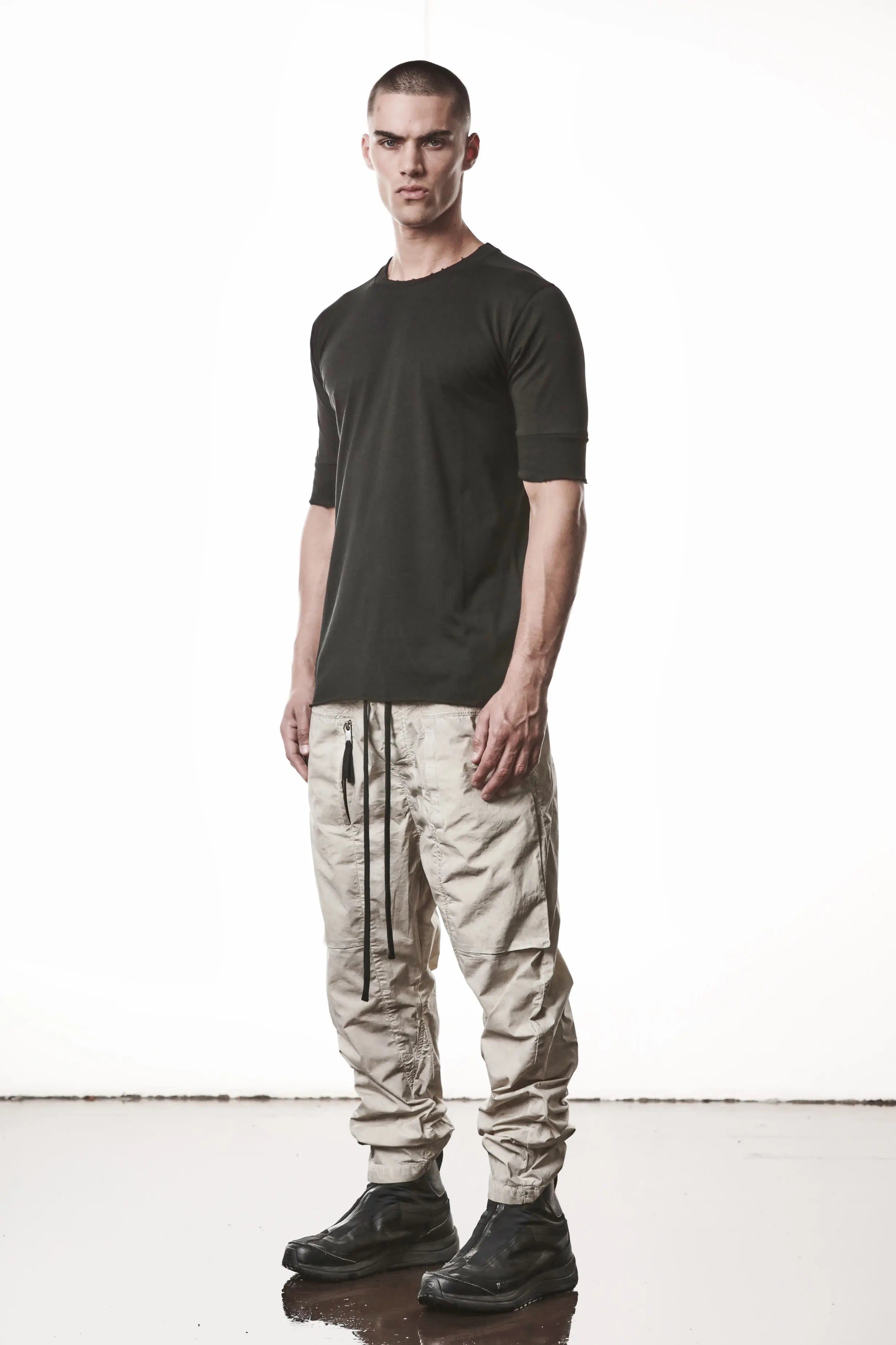 Thom Krom, Mens T-Shirt, Black, Cotton Modal Jersey, Ribbed Cuffs, Short Sleeves, Round Neck, Slim fit, Full Body 3/4 Front View. 