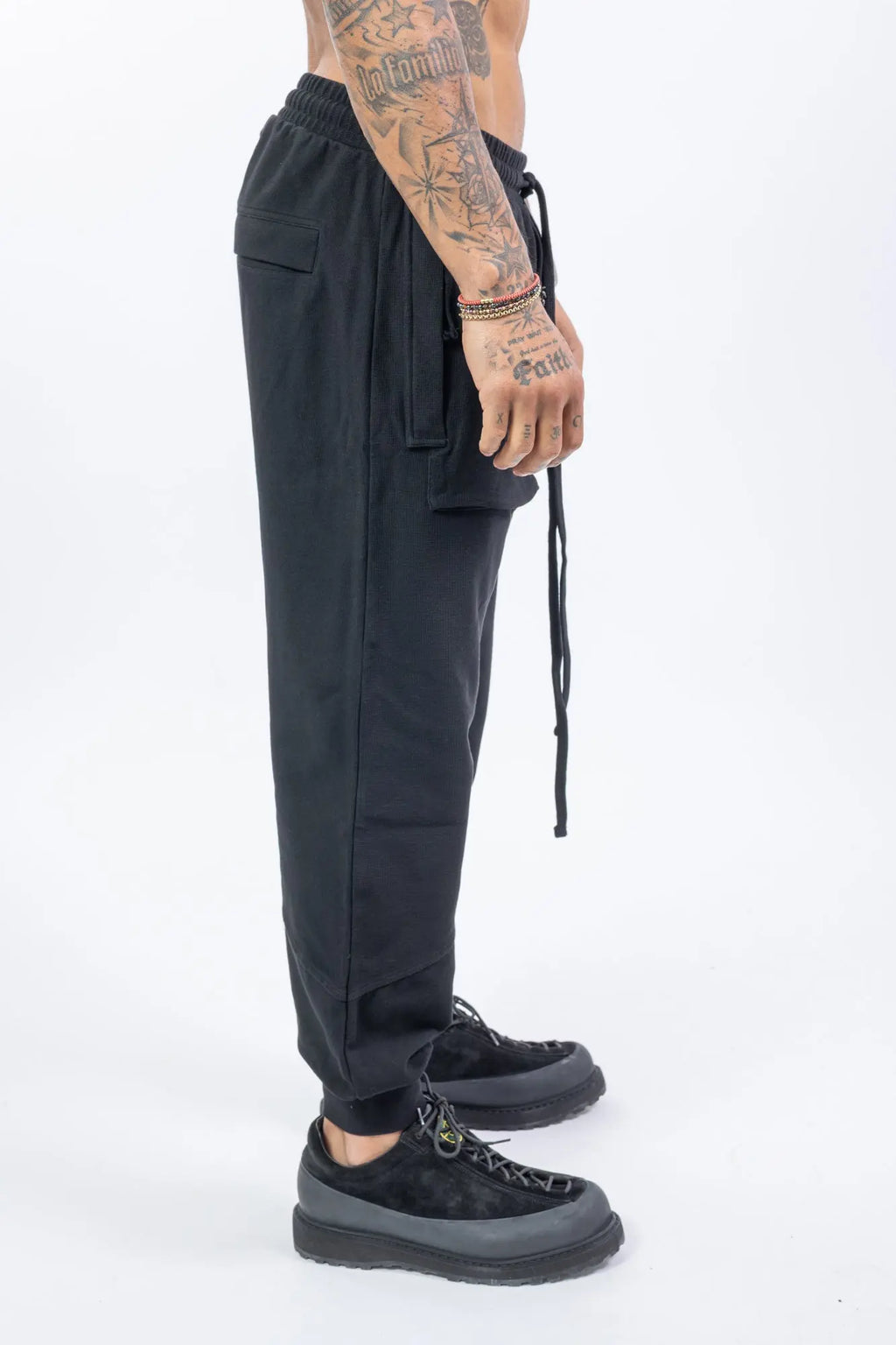 Thom Krom,Mens Cargo Pants,Multipocket Cargo,Adjustable Waistband With Drawstrings,Tapered Cuffs,Rib Knit Premium Cotton Blend,Dropped Inseam,Button Fly,Profile Photo.