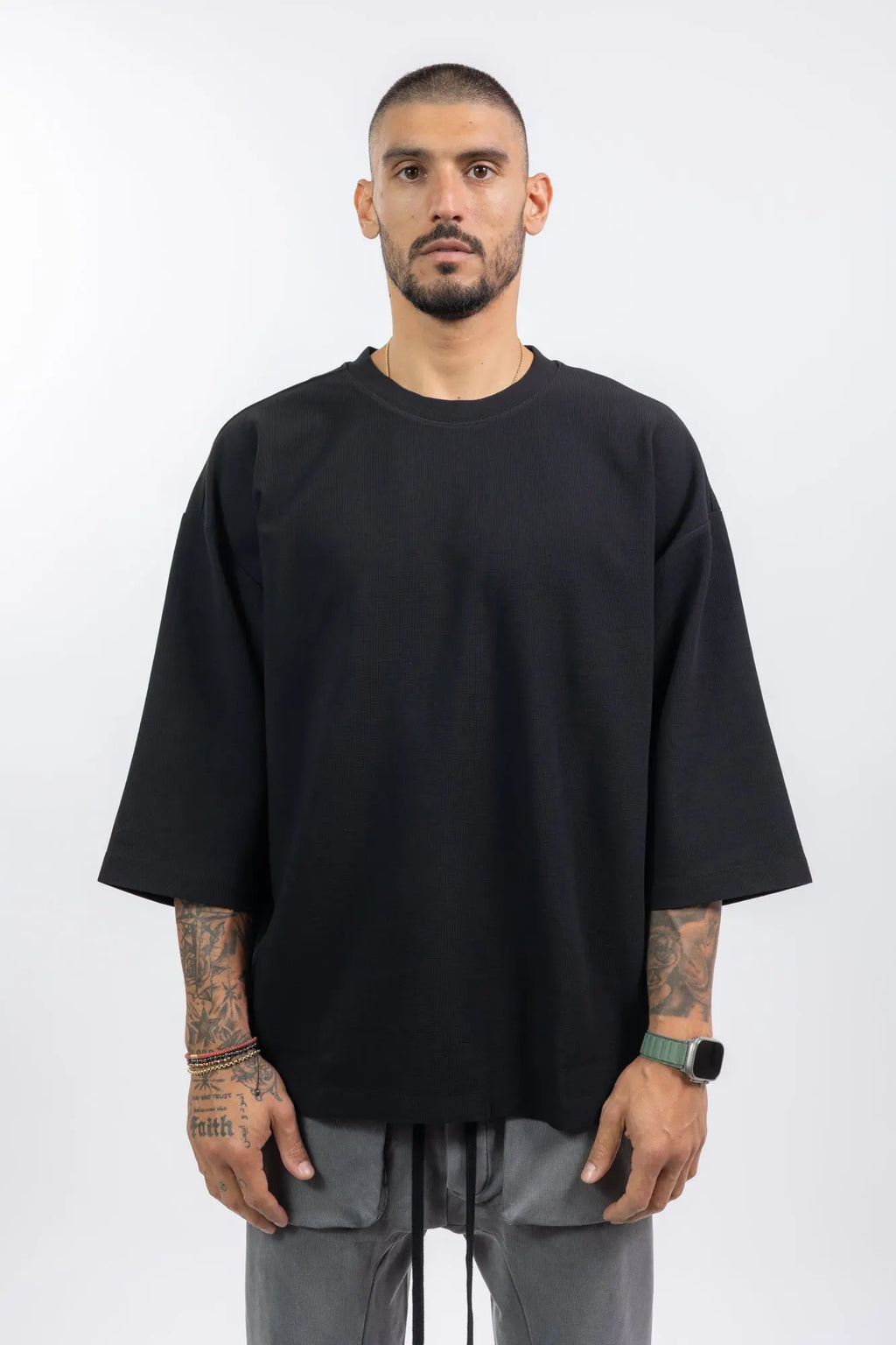 Thom Krom,Mens T-Shirt,Black,Oversized Fit,Rib Knit Crewneck,Dropped Shoulders,Logo Embroidery On The Back,Wide Sleeves Design,Front Portrait.