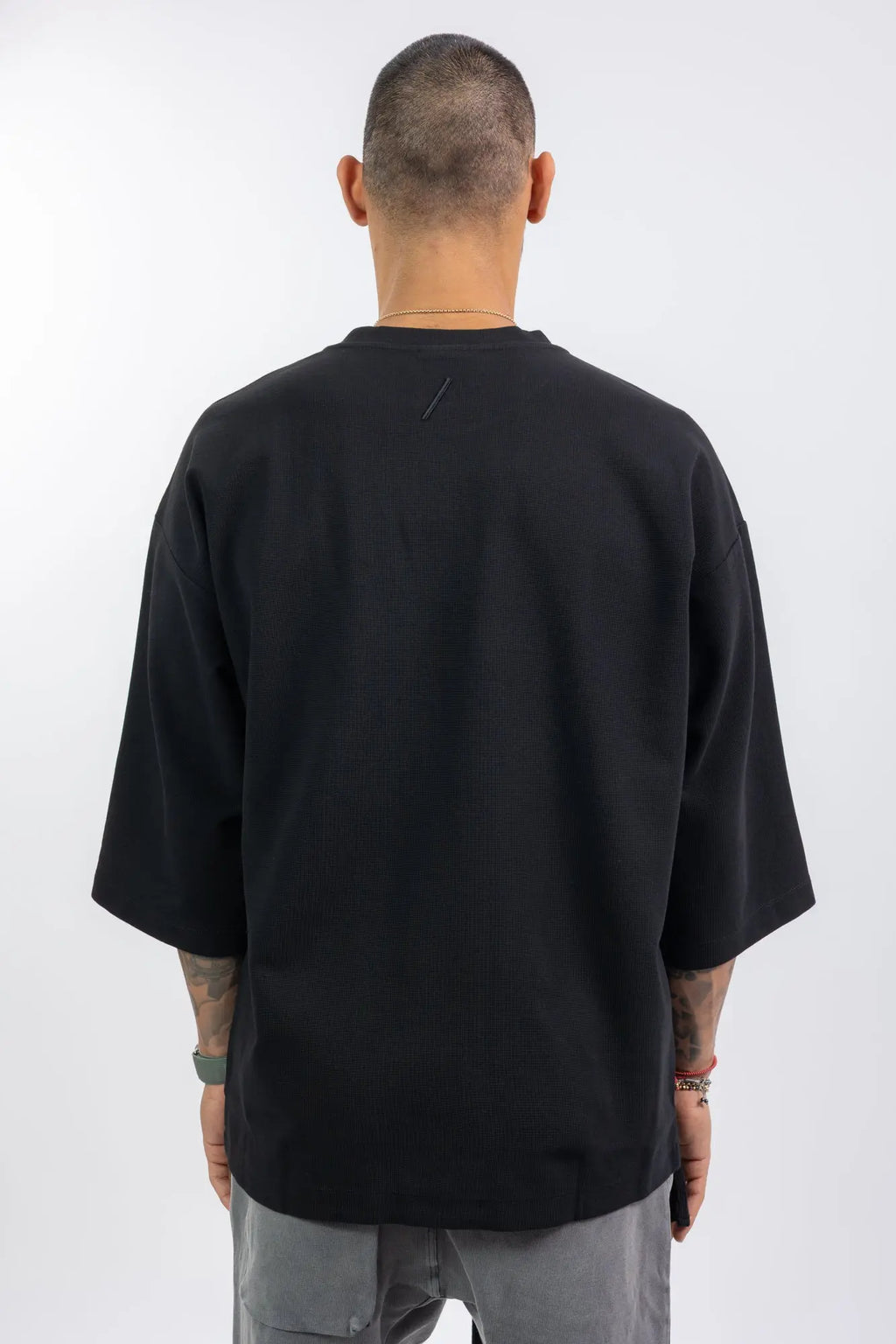 Thom Krom,Mens T-Shirt,Black,Oversized Fit,Rib Knit Crewneck,Dropped Shoulders,Logo Embroidery On The Back,Wide Sleeves Design,Back Photo.