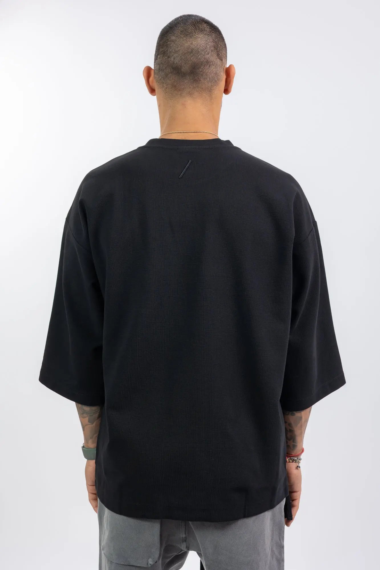 Thom Krom,Mens T-Shirt,Black,Oversized Fit,Rib Knit Crewneck,Dropped Shoulders,Logo Embroidery On The Back,Wide Sleeves Design,Back Photo.