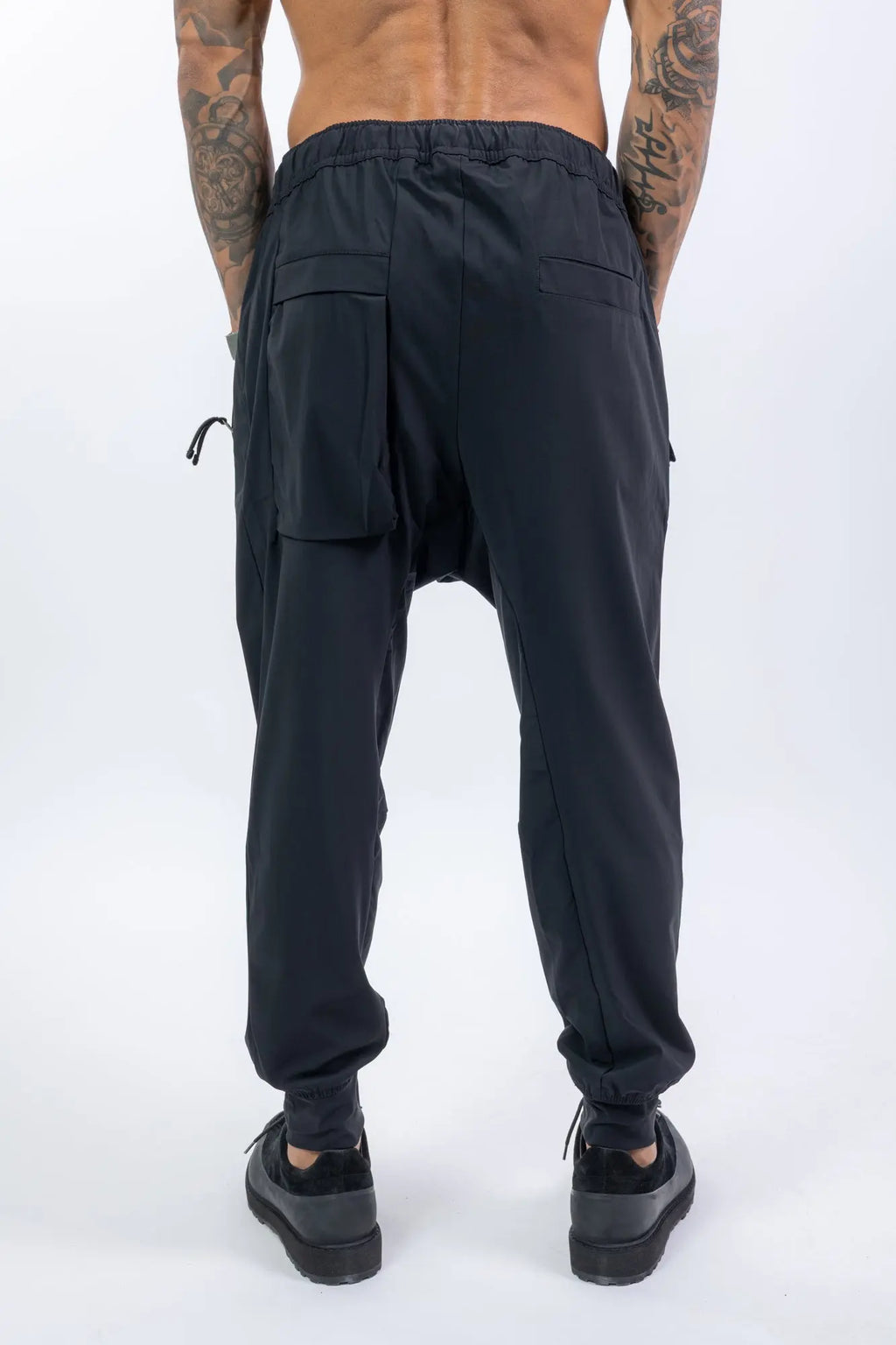 Thom Krom,Mens Trousers,Black,Low Crotch,Integrated Cinch Belt At Waistband,Front Zip Pockets,Back Welt And Cargo Pockets,Concealed Safety Pocket,Power Evo Stretch Fabric,Back Photo