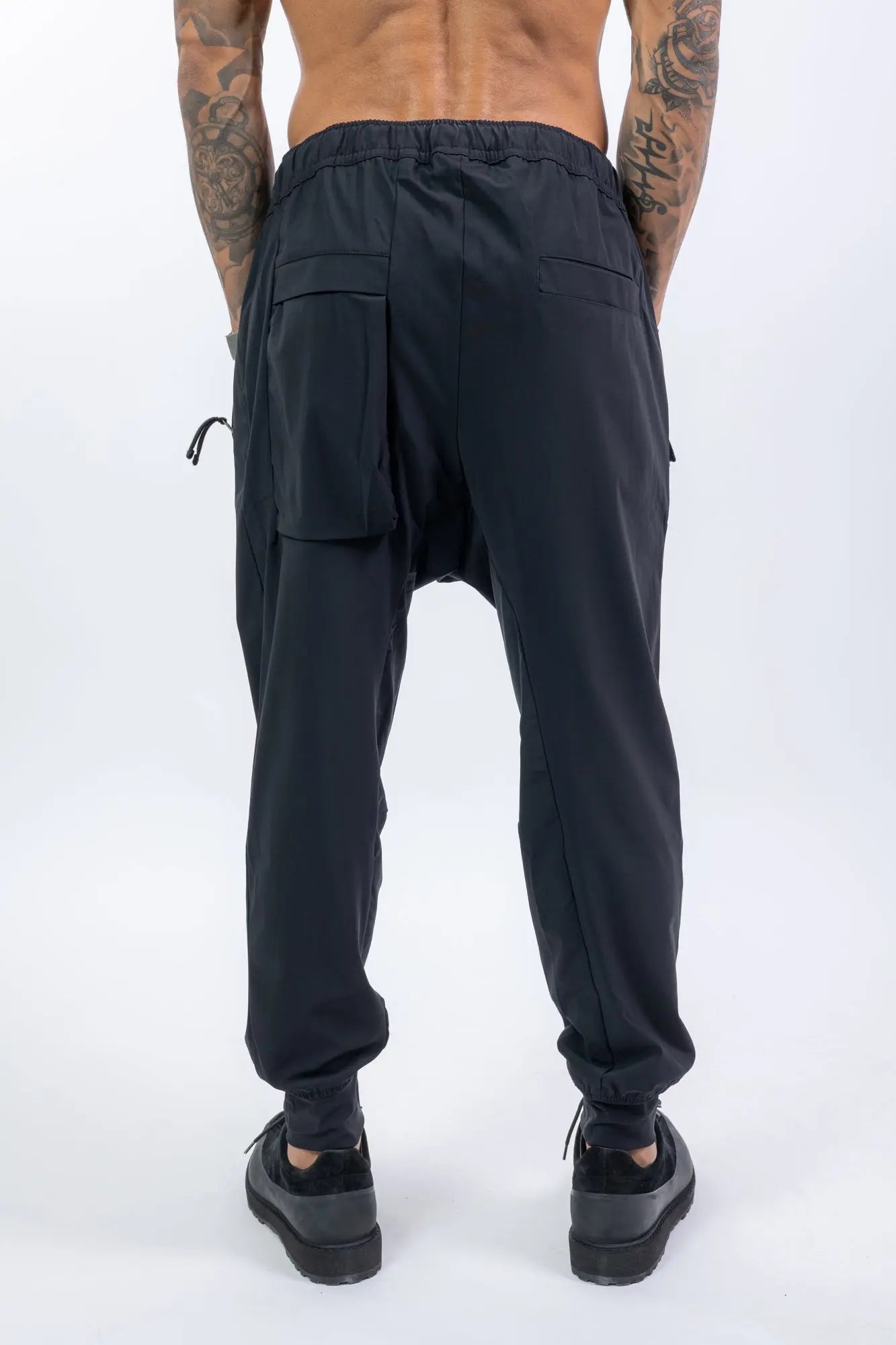Thom Krom,Mens Trousers,Black,Low Crotch,Integrated Cinch Belt At Waistband,Front Zip Pockets,Back Welt And Cargo Pockets,Concealed Safety Pocket,Power Evo Stretch Fabric,Back Photo