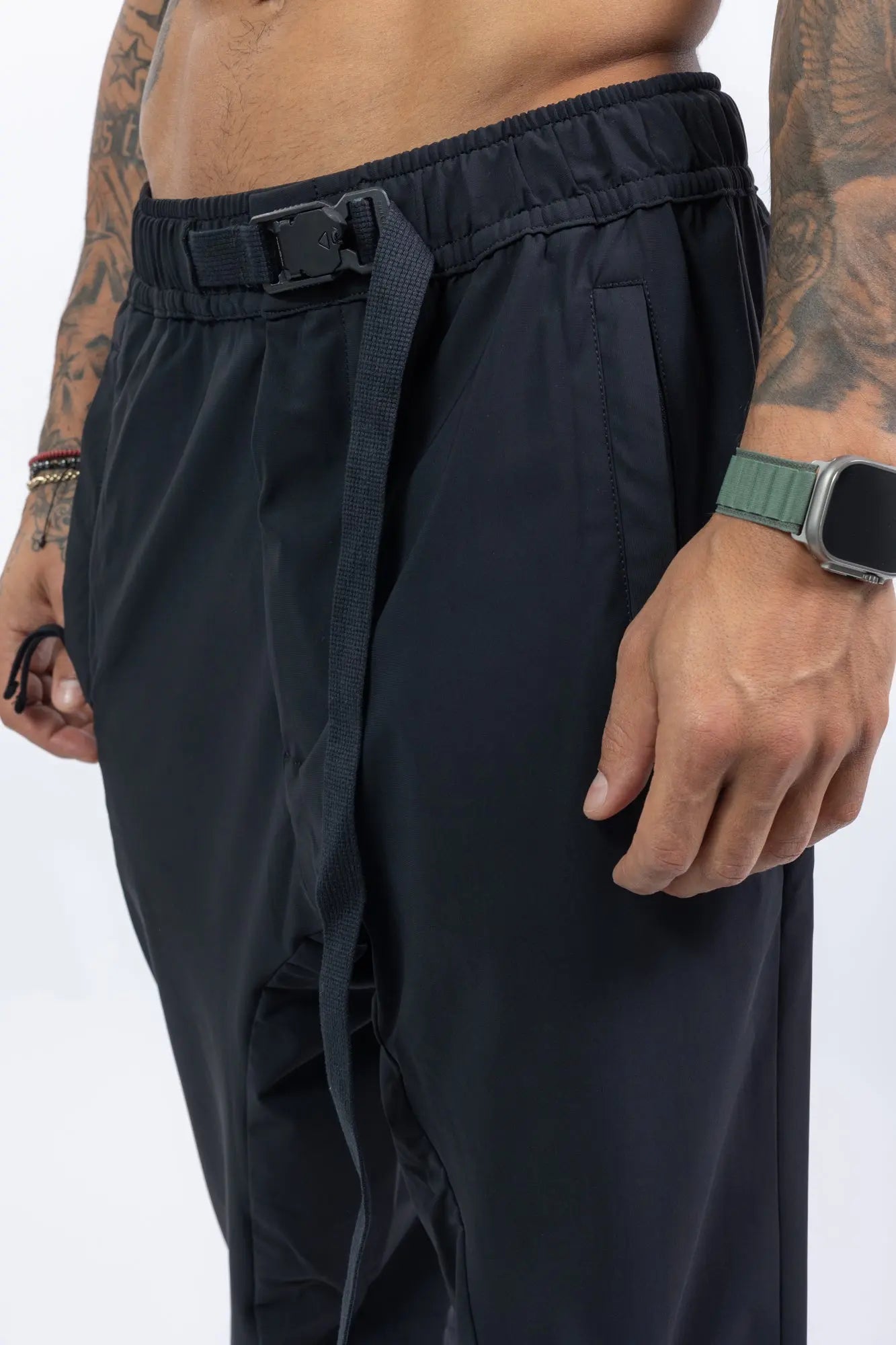 Thom Krom,Mens Trousers,Black,Low Crotch,Integrated Cinch Belt At Waistband,Front Zip Pockets,Back Welt And Cargo Pockets,Concealed Safety Pocket,Power Evo Stretch Fabric,Belt Close Up Photo