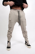 Thom Krom, Mens Pants, Moongery, Beige, Cargo Pockets, Large Pockets, Stretch Nylon Inserts, Elasticated Waistband, Drawstring, Elasticated Cuffs, Front View. 