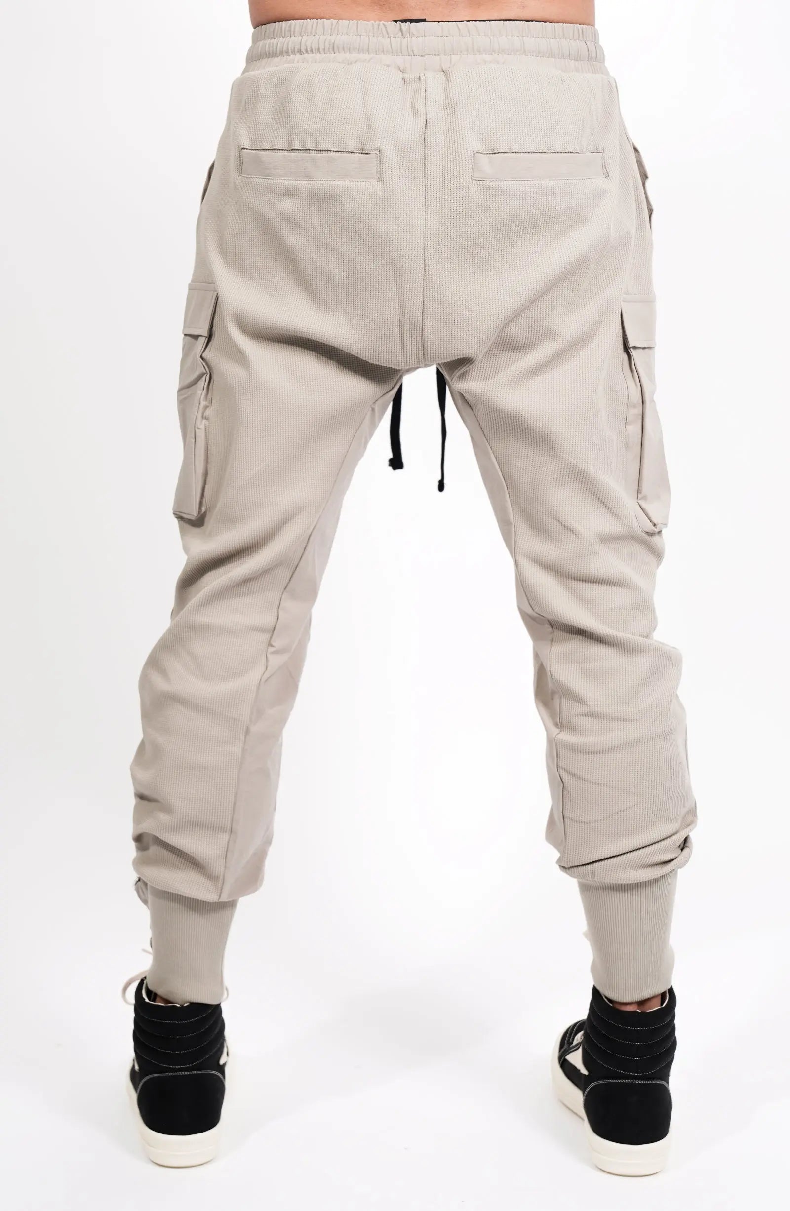 Thom Krom, Mens Pants, Moongery, Beige, Cargo Pockets, Large Pockets, Stretch Nylon Inserts, Elasticated Waistband, Drawstring, Elasticated Cuffs, Back View. 