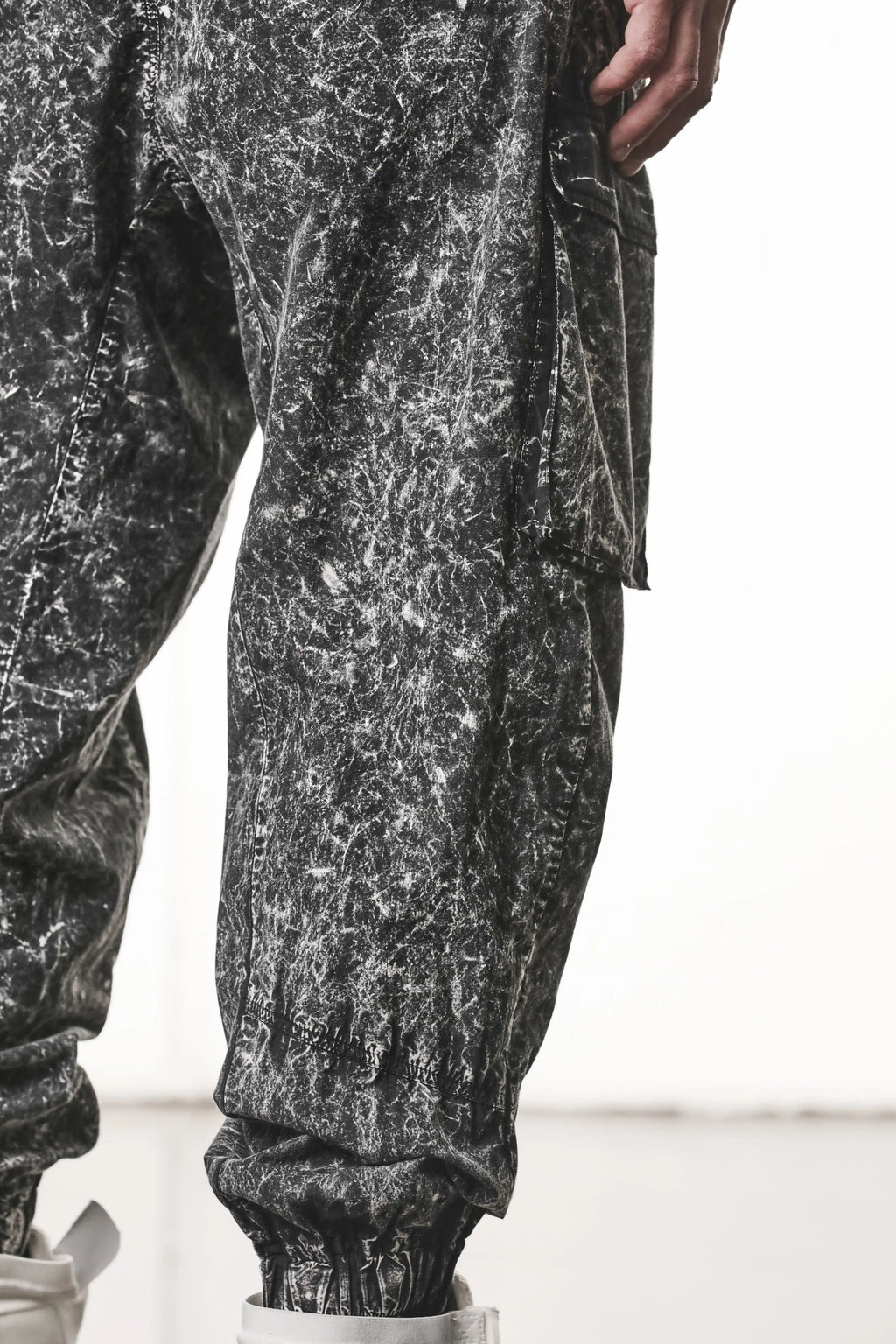Thom Krom, Mens Trousers, Black, Cargo Pants, Zip Pockets, Side Pockets, Drawstring, Elasticated Waistband, Elasticated Ankle Cuffs, Drop-Crotch, Back Pockets, YKK Zippers, Back View Cargo Pocket Close-up. 