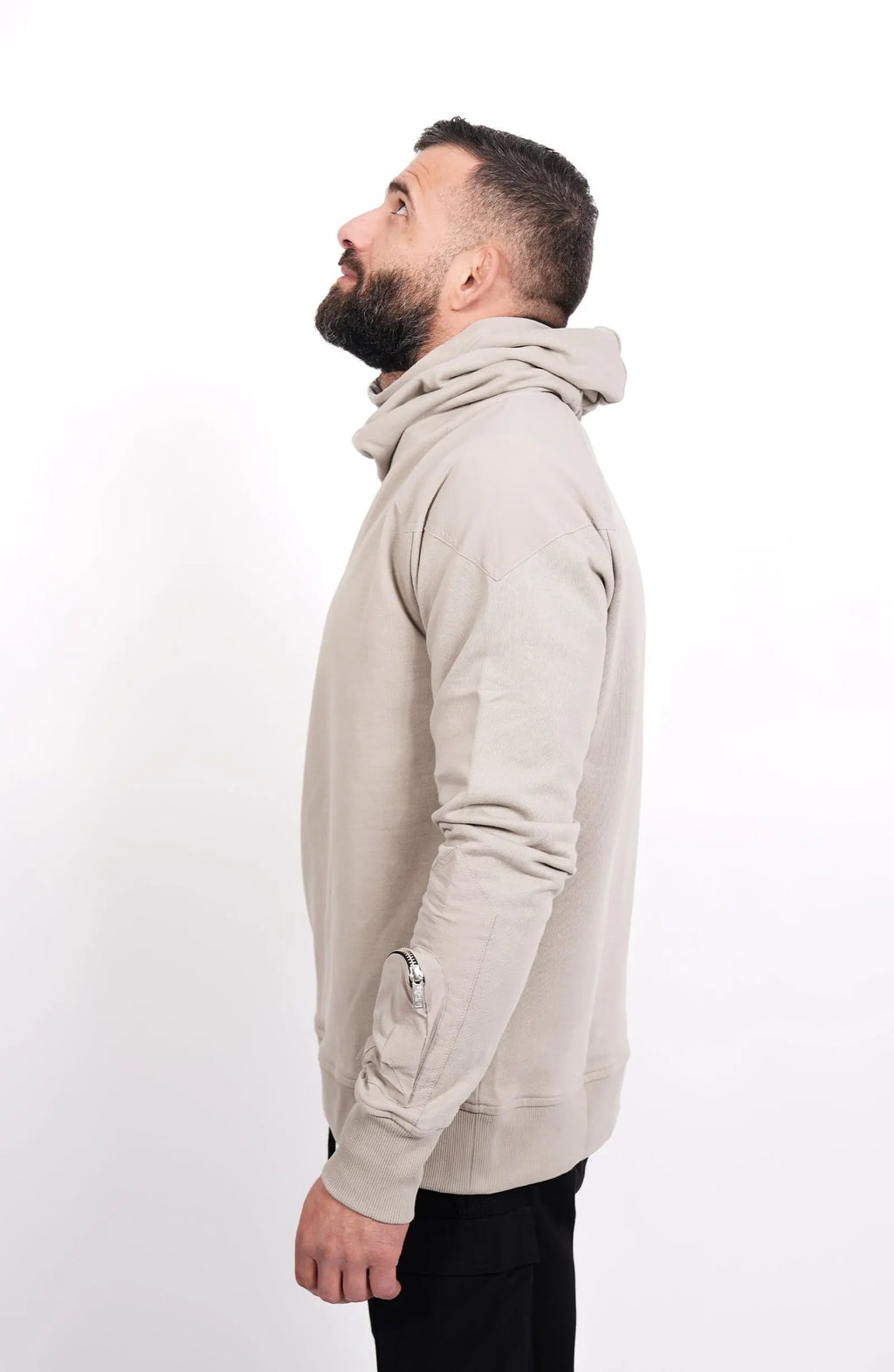 Thom Krom, Mens Hoodie, Black, Hooded Sweatshirt, Cotton, Stretch Nylon Inserts, Stretch Cotton Cuffs and Inserts, Cotton Jersey, Thumbholes, Mock Neck, Sleeve Zip Pocket, Side View Looking Upwards. 
