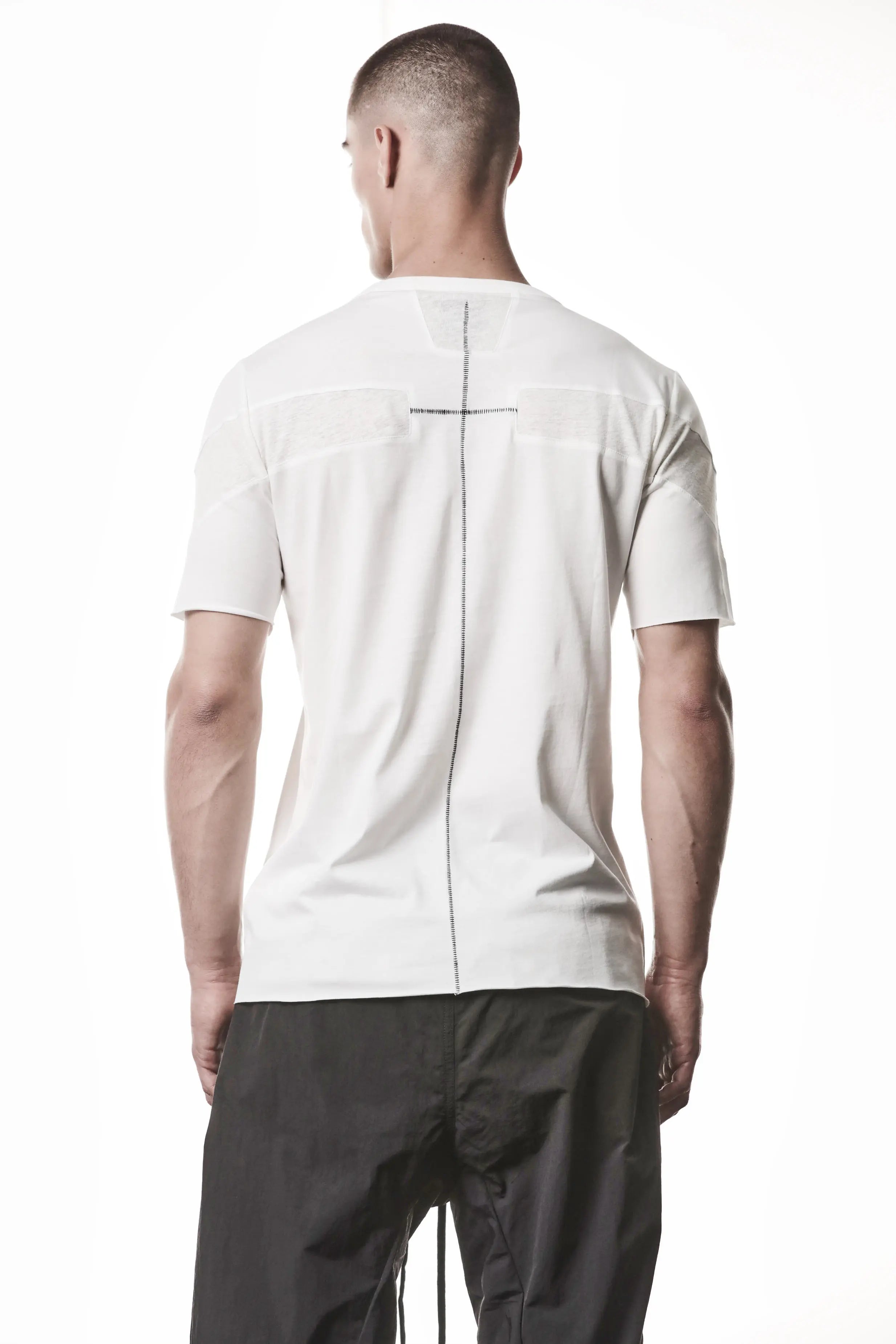 Thom Krom, Mens T-Shirt, White, Cotton Jersey with breathability Inserts, Viscose Linen Inserts, Crewneck, Short Sleeves, Lightweight, 100% Cotton, Signature Cross Black Seams, Back View. 