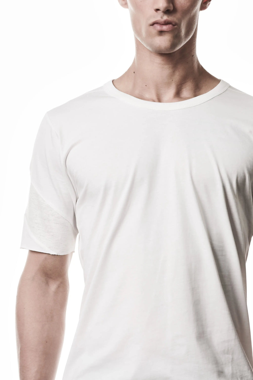 Thom Krom, Mens T-Shirt, White, Cotton Jersey with breathability Inserts, Viscose Linen Inserts, Crewneck, Short Sleeves, Lightweight, 100% Cotton, Signature Cross Black Seams, The Night is your friend, my love, Right Shoulder Fit Close-up. 
