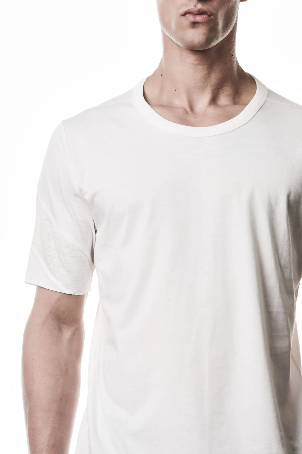 Thom Krom, Mens T-Shirt, White, Cotton Jersey with breathability Inserts, Viscose Linen Inserts, Crewneck, Short Sleeves, Lightweight, 100% Cotton, Signature Cross Black Seams, The Night is your friend, my love, Front Portrait Close-up. 