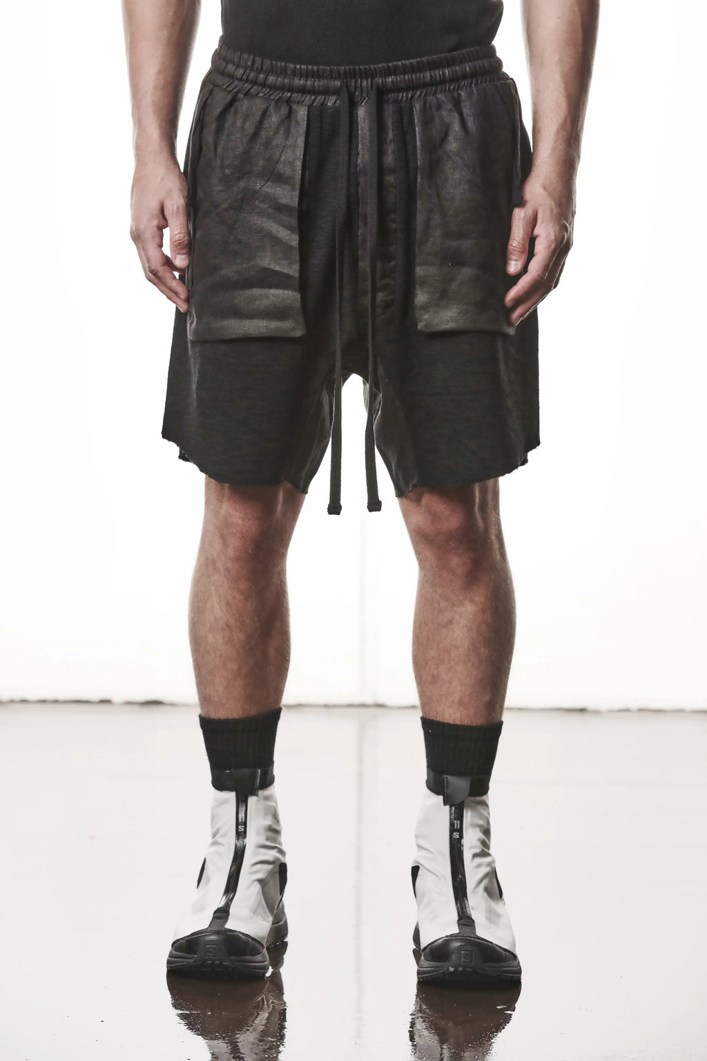 Thom Krom, Mens Shorts, Black, Hidden Zip Pockets, Elasticated Waistband, Linen Inserts, Drawstring, Side Pockets, Back Pockets, The night is your friend, my love, Front Portrait. 