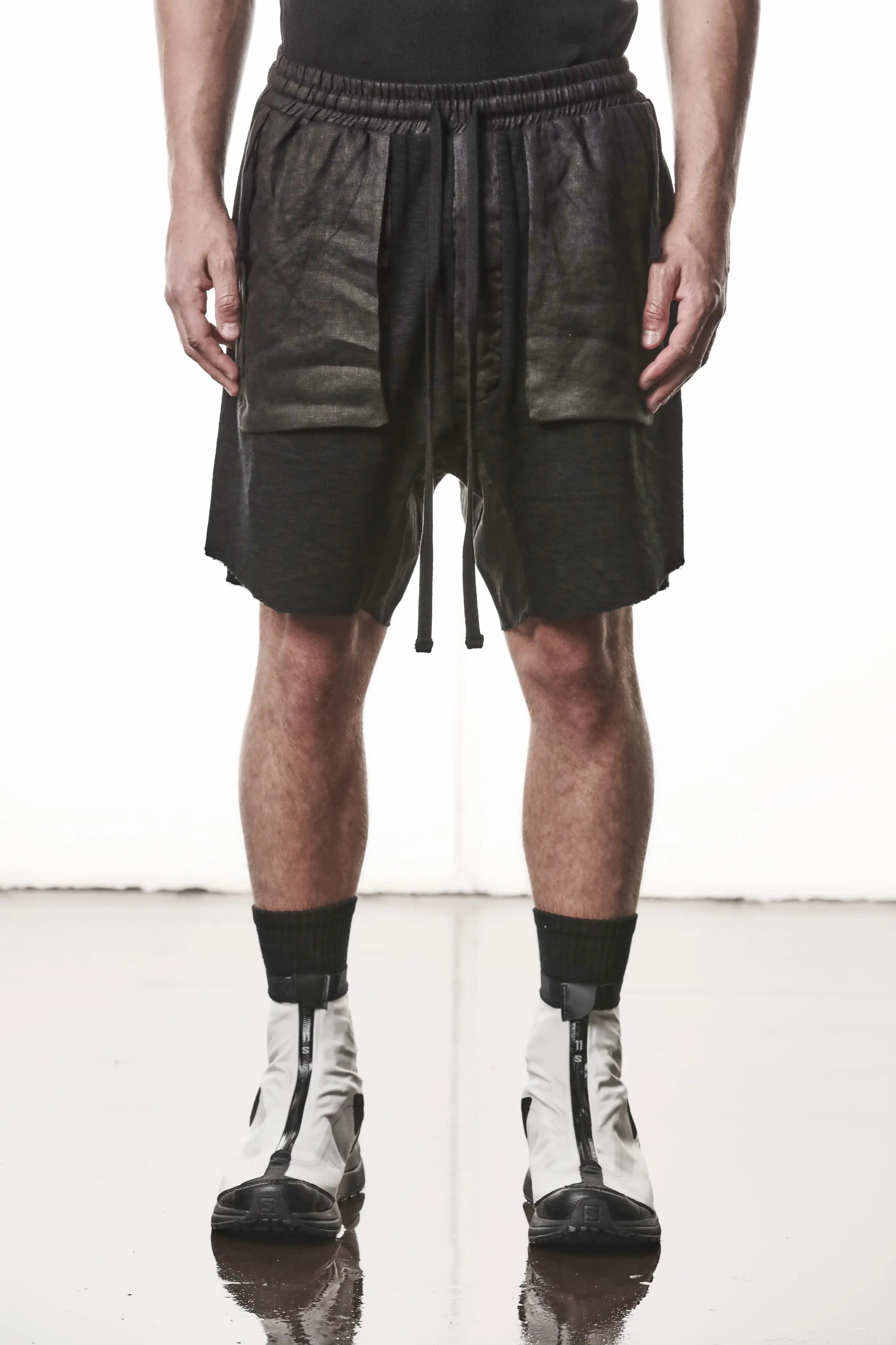 Thom Krom, Mens Shorts, Black, Hidden Zip Pockets, Elasticated Waistband, Linen Inserts, Drawstring, Side Pockets, Back Pockets, The night is your friend, my love, Front Portrait. 