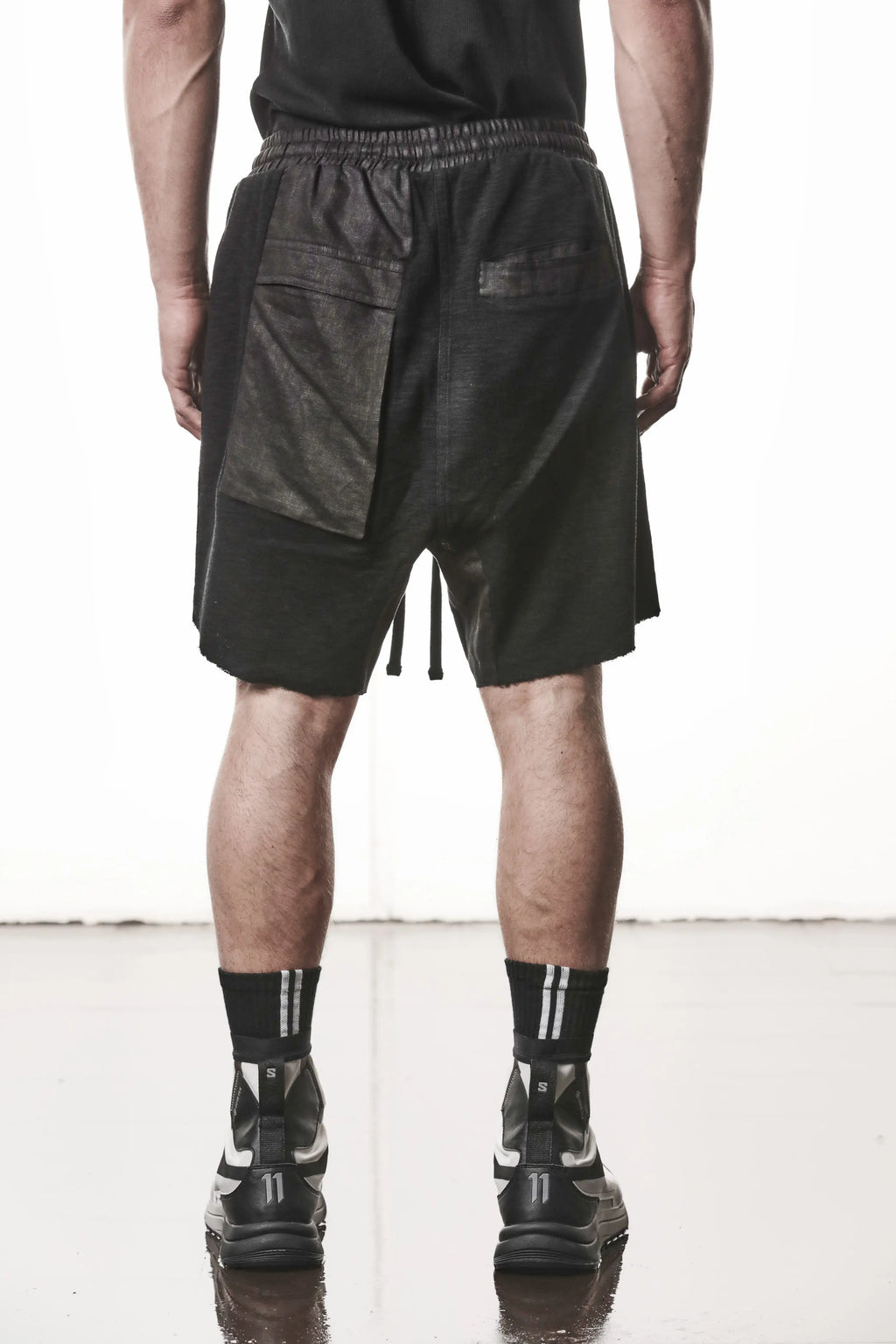Thom Krom, Mens Shorts, Black, Hidden Zip Pockets, Elasticated Waistband, Linen Inserts, Drawstring, Side Pockets, Back Pockets, The night is your friend, my love, Back Portrait. 