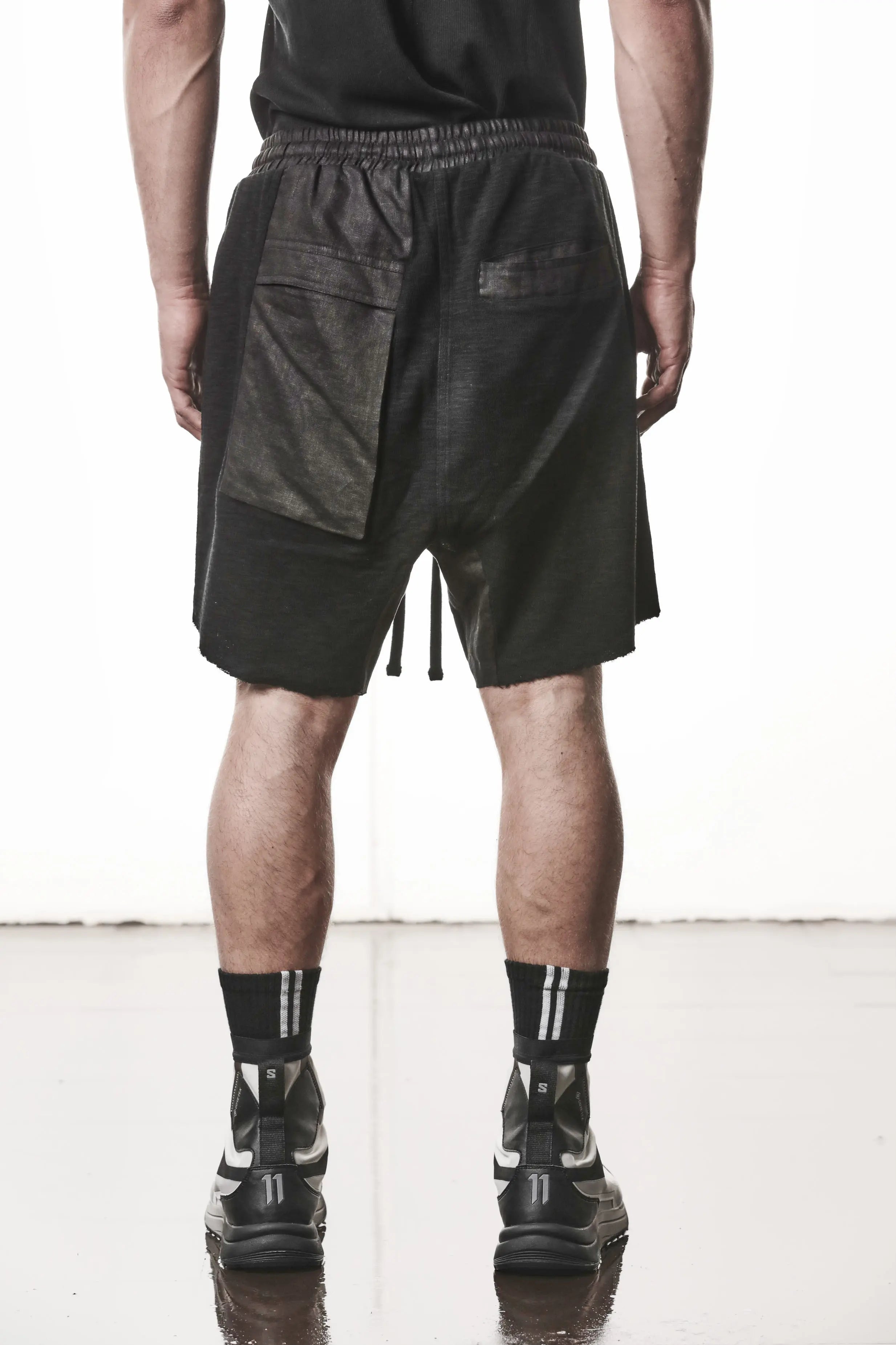 Thom Krom, Mens Shorts, Black, Hidden Zip Pockets, Elasticated Waistband, Linen Inserts, Drawstring, Side Pockets, Back Pockets, The night is your friend, my love, Back Portrait. 