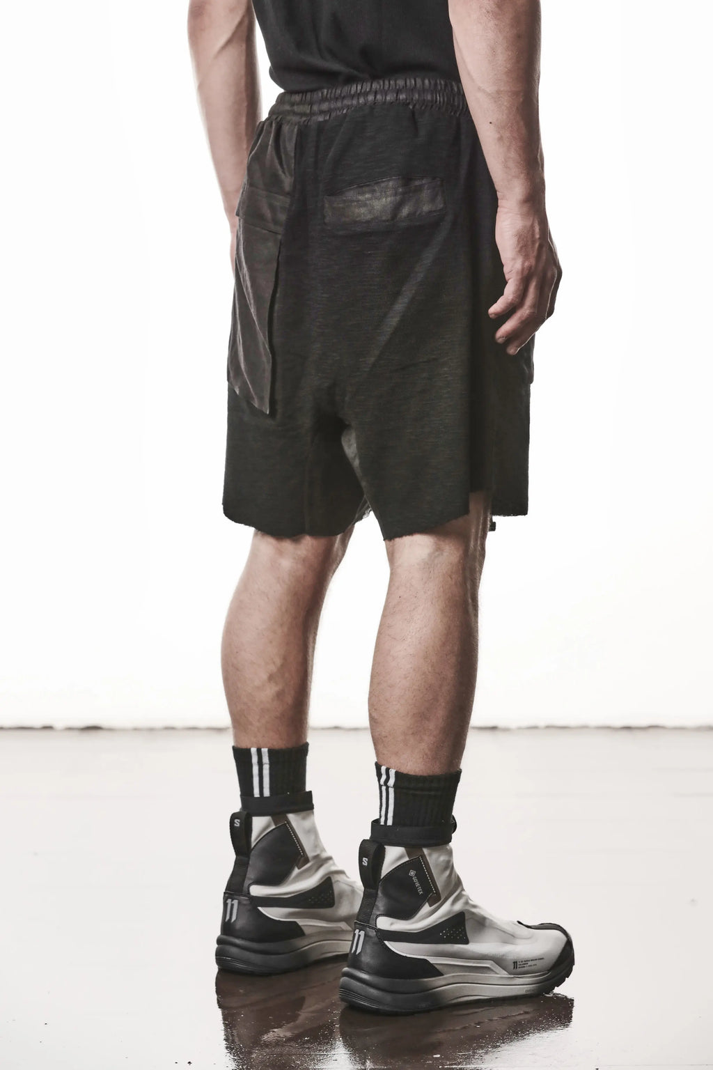 Thom Krom, Mens Shorts, Black, Hidden Zip Pockets, Elasticated Waistband, Linen Inserts, Drawstring, Side Pockets, Back Pockets, The night is your friend, my love, Back 3/4 View. 