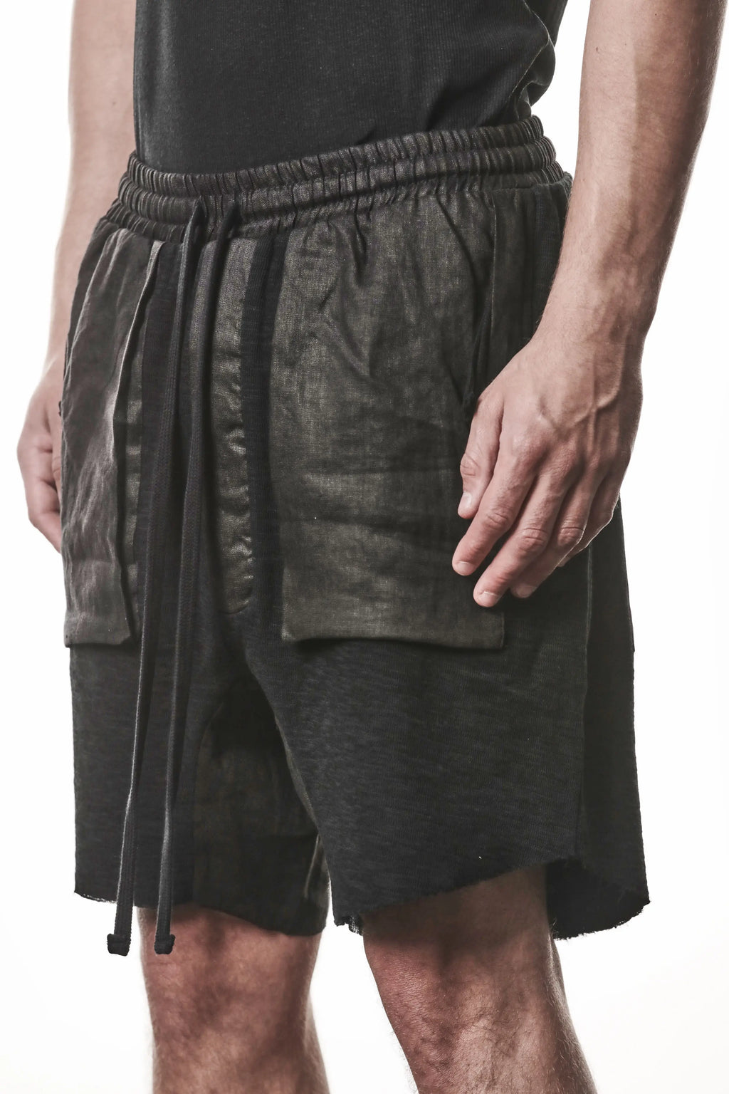 Thom Krom, Mens Shorts, Black, Hidden Zip Pockets, Elasticated Waistband, Linen Inserts, Drawstring, Side Pockets, Back Pockets, The night is your friend, my love, Front 3/4 Close-up View. 