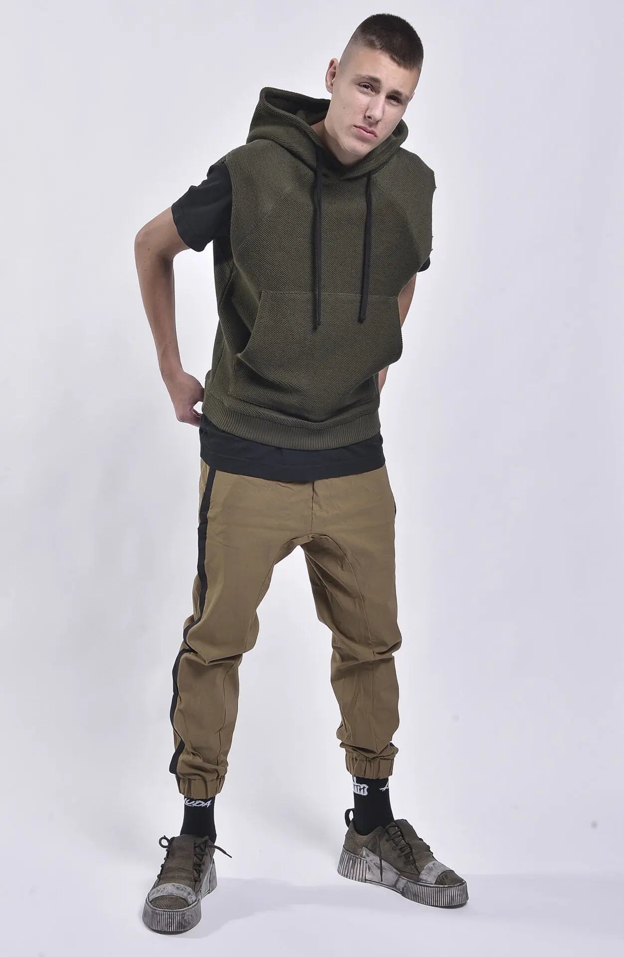 Thom Krom, Mens Vest, Green, Hooded, Sleeveless Hoodie, Hooded Sleveless Sweatshirt, Drawstring Hood, Front Pocket, Ribbed Hem, Raglan Sleeves, Raw-Cut Sleeve Holes, Full Body in-motion Front View. 