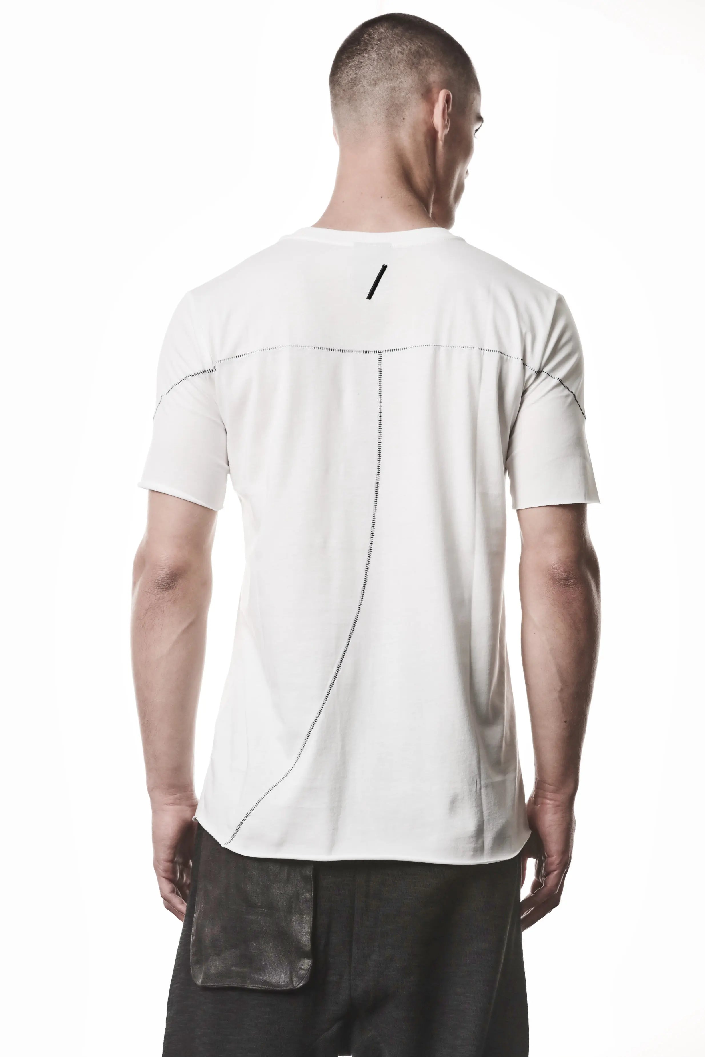 Thom Krom, Mens T-Shirt, Off-White, Raw-Cut Hem, Elastic Neck, 100% Cotton, Short Sleeves, Crewneck, Round Neck, Dark Seams, Back Seams, Embroidered Logo, Back View. 