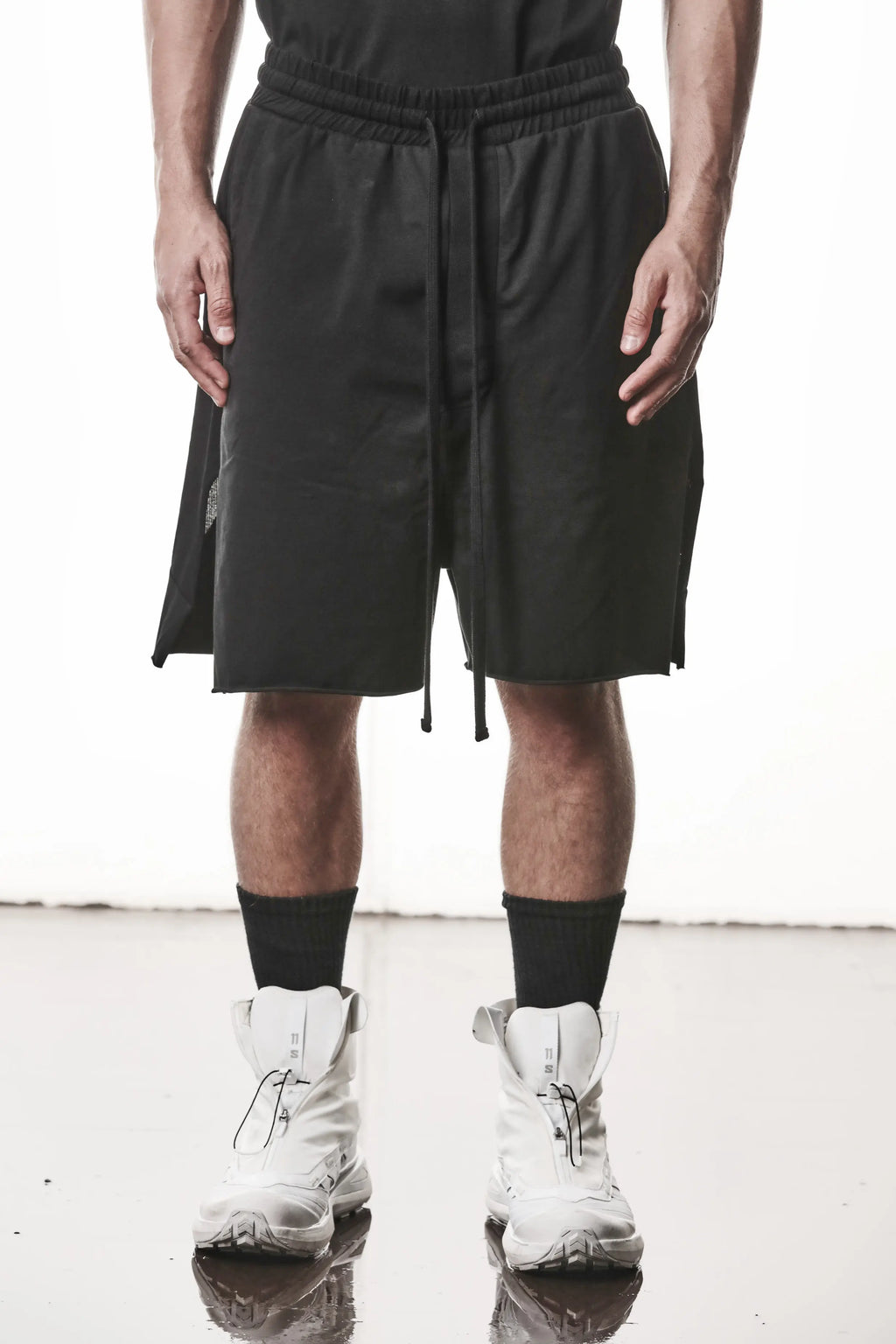Thom Krom, Mens Shorts, Black, Stretch Cotton, Cotton-Elastane Blend, Spandex, Elasticated Waistband, Drawstring, Side Pockets, Raw-Cut Side Slits, Front Portrait. 