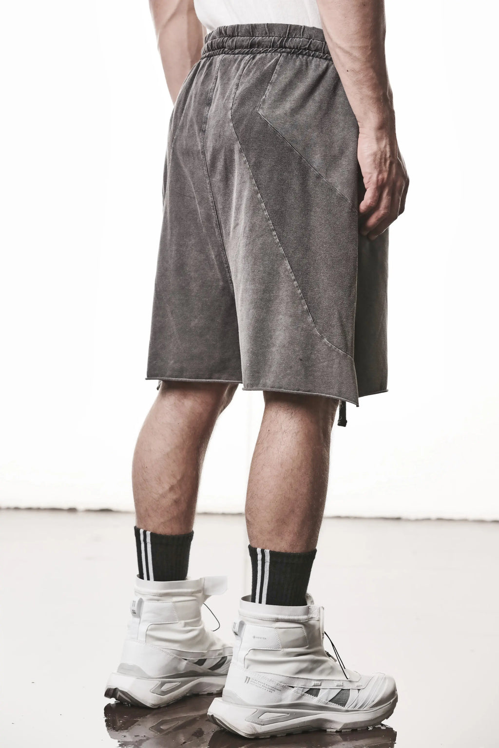 Thom Krom, Mens Shorts, Dark Used Grey, Stretch Cotton, Cotton-Elastane Blend, Spandex, Elasticated Waistband, Drawstring, Side Pockets, Raw-Cut Side Slits, Back 3/4 Inserts View. 