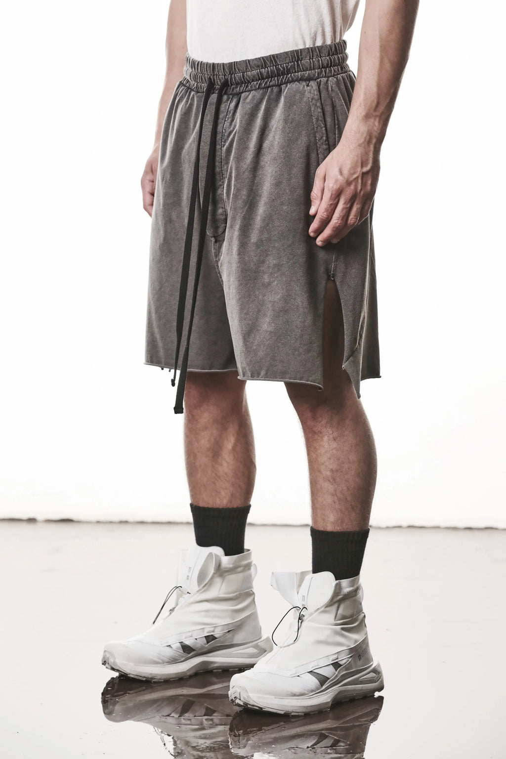 Thom Krom, Mens Shorts, Dark Used Grey, Stretch Cotton, Cotton-Elastane Blend, Spandex, Elasticated Waistband, Drawstring, Side Pockets, Raw-Cut Side Slits, Front 3/4 View. 