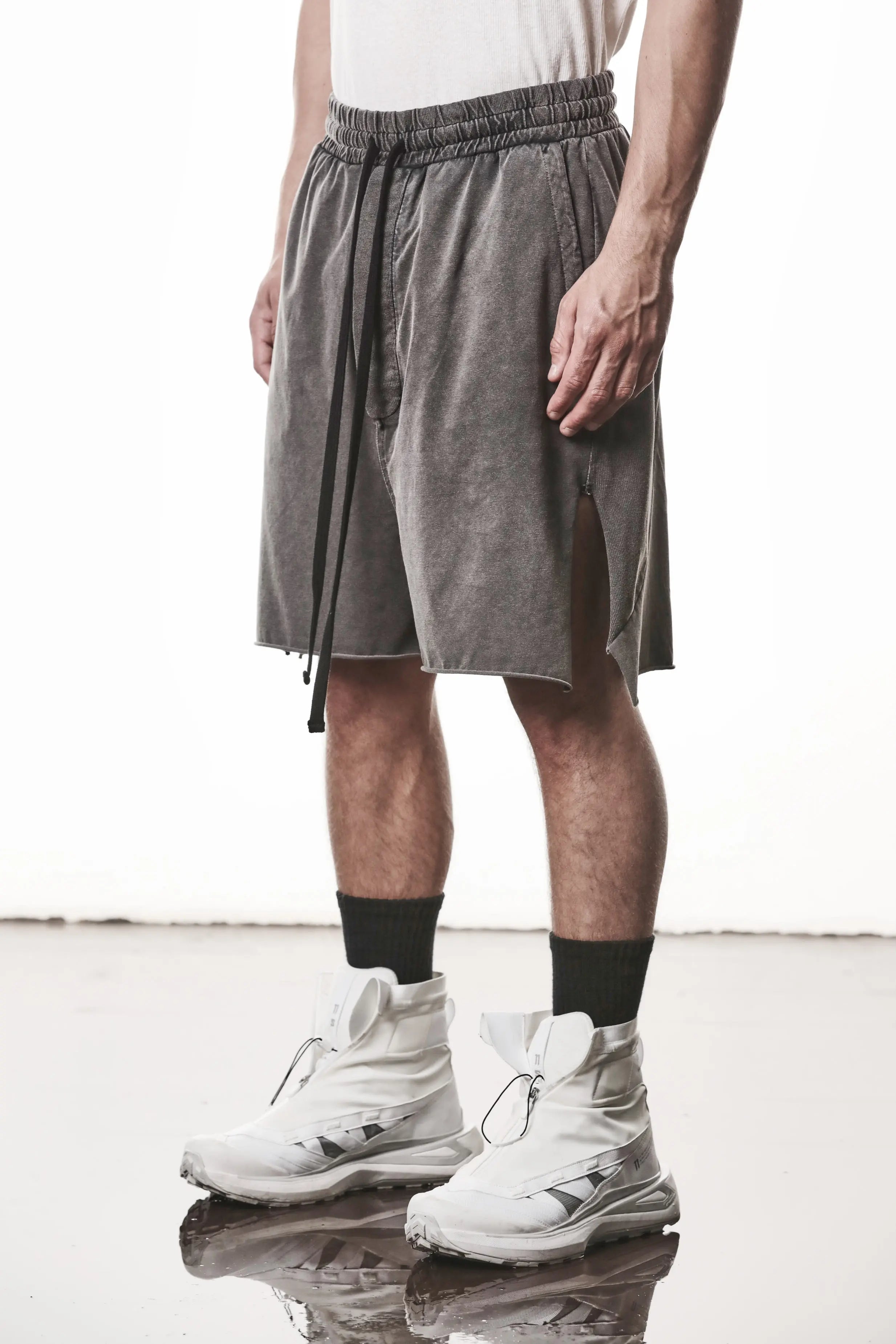 Thom Krom, Mens Shorts, Dark Used Grey, Stretch Cotton, Cotton-Elastane Blend, Spandex, Elasticated Waistband, Drawstring, Side Pockets, Raw-Cut Side Slits, Front 3/4 View. 