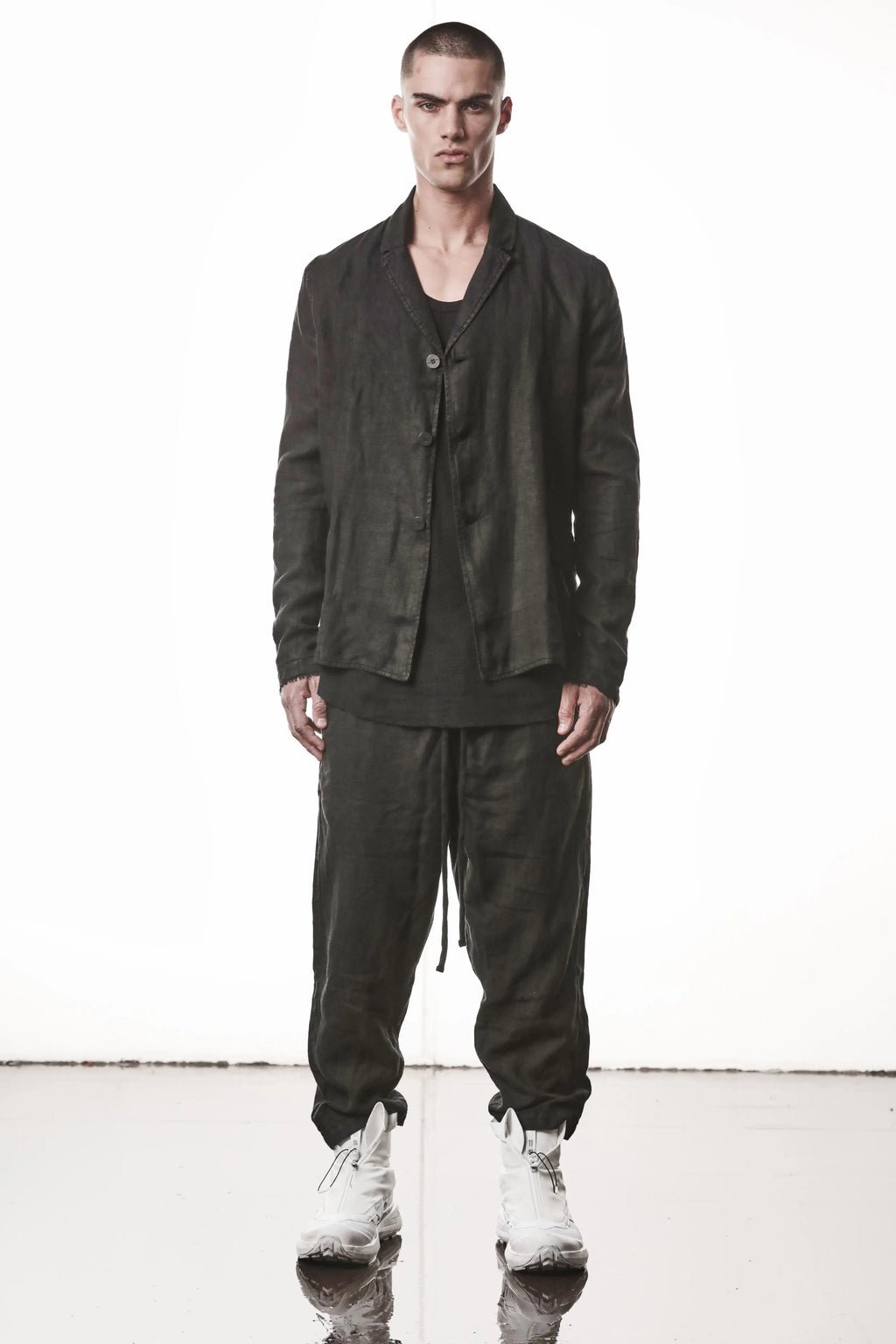 Thom Krom, Mens Blazer, Black, 100% Linen Shell, Cotton & Polyester/Viscose Linings, 3-button closure, Flap Pockets, Hidden Inner Pockets, Relaxed Detailing, Woven Fabric, Full Body Front View. 