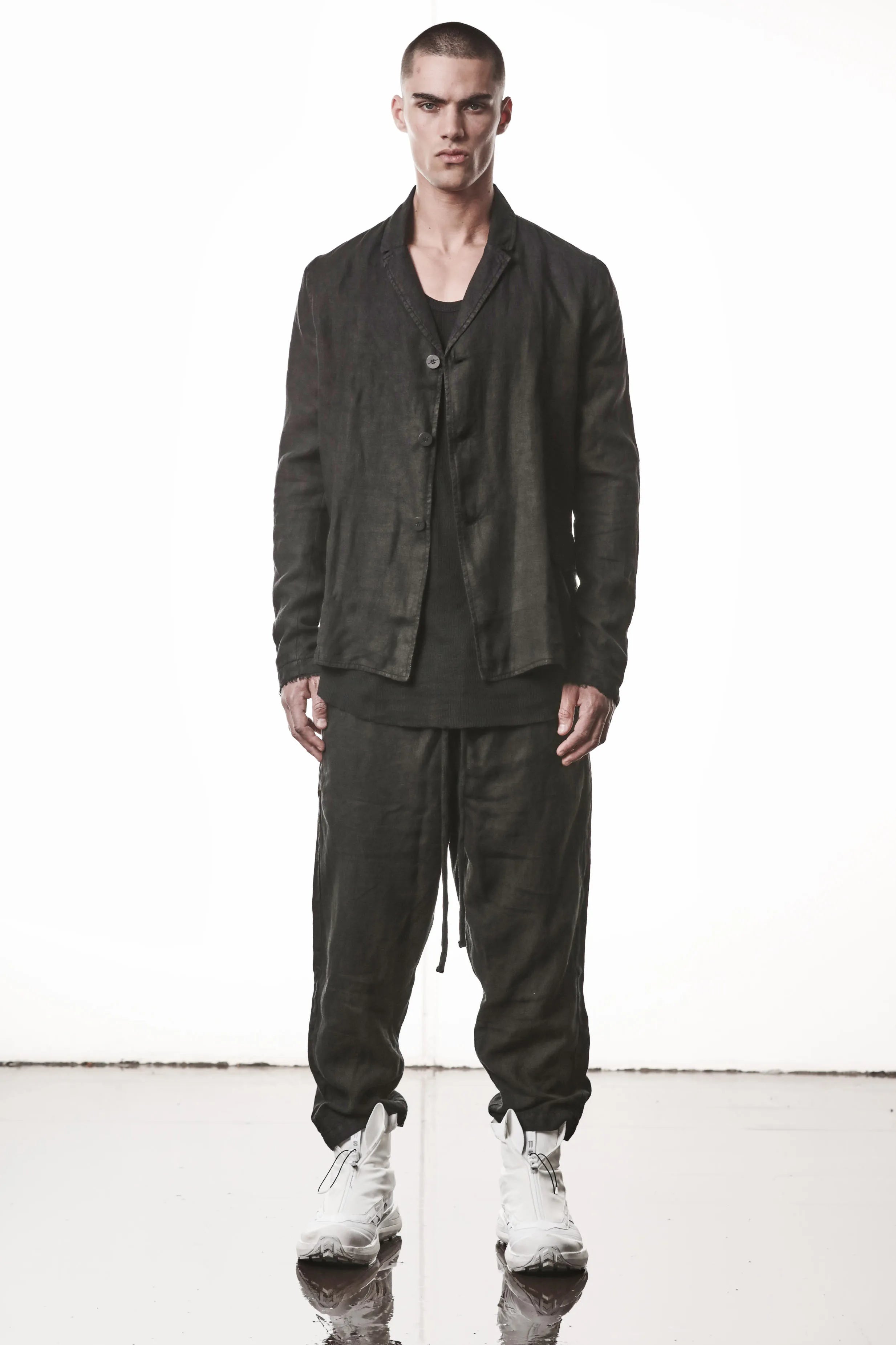 Thom Krom, Mens Blazer, Black, 100% Linen Shell, Cotton & Polyester/Viscose Linings, 3-button closure, Flap Pockets, Hidden Inner Pockets, Relaxed Detailing, Woven Fabric, Full Body Front View. 