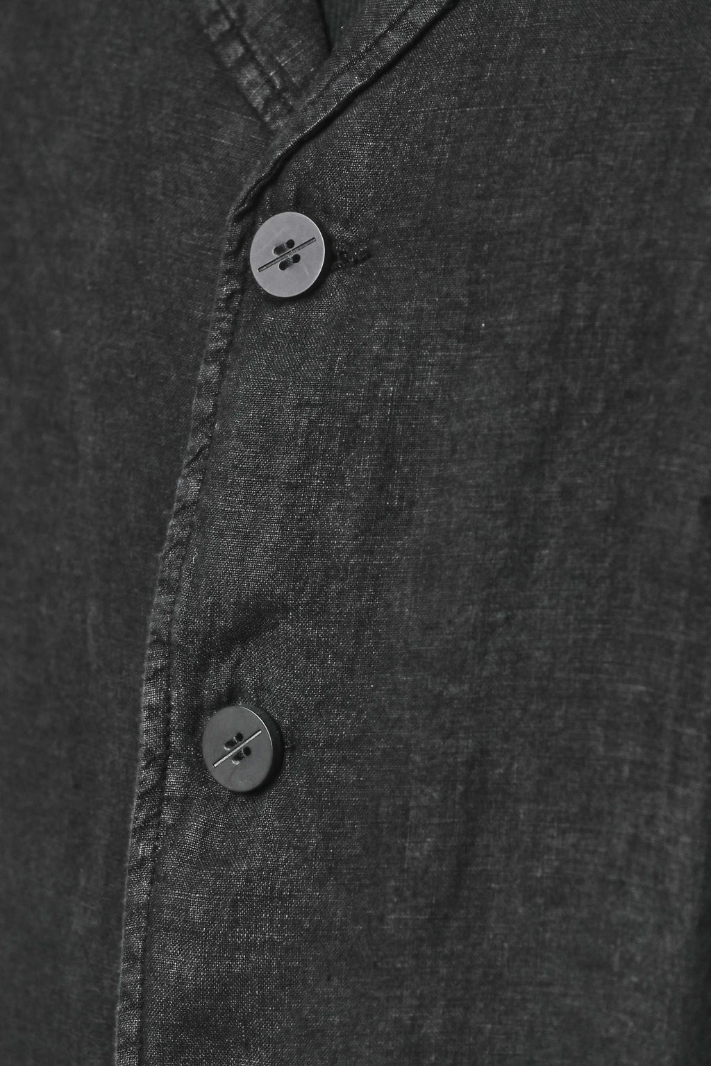 Thom Krom, Mens Blazer, Black, 100% Linen Shell, Cotton & Polyester/Viscose Linings, 3-button closure, Flap Pockets, Hidden Inner Pockets, Relaxed Detailing, Woven Fabric, 2/3 Buttons Close-up. 