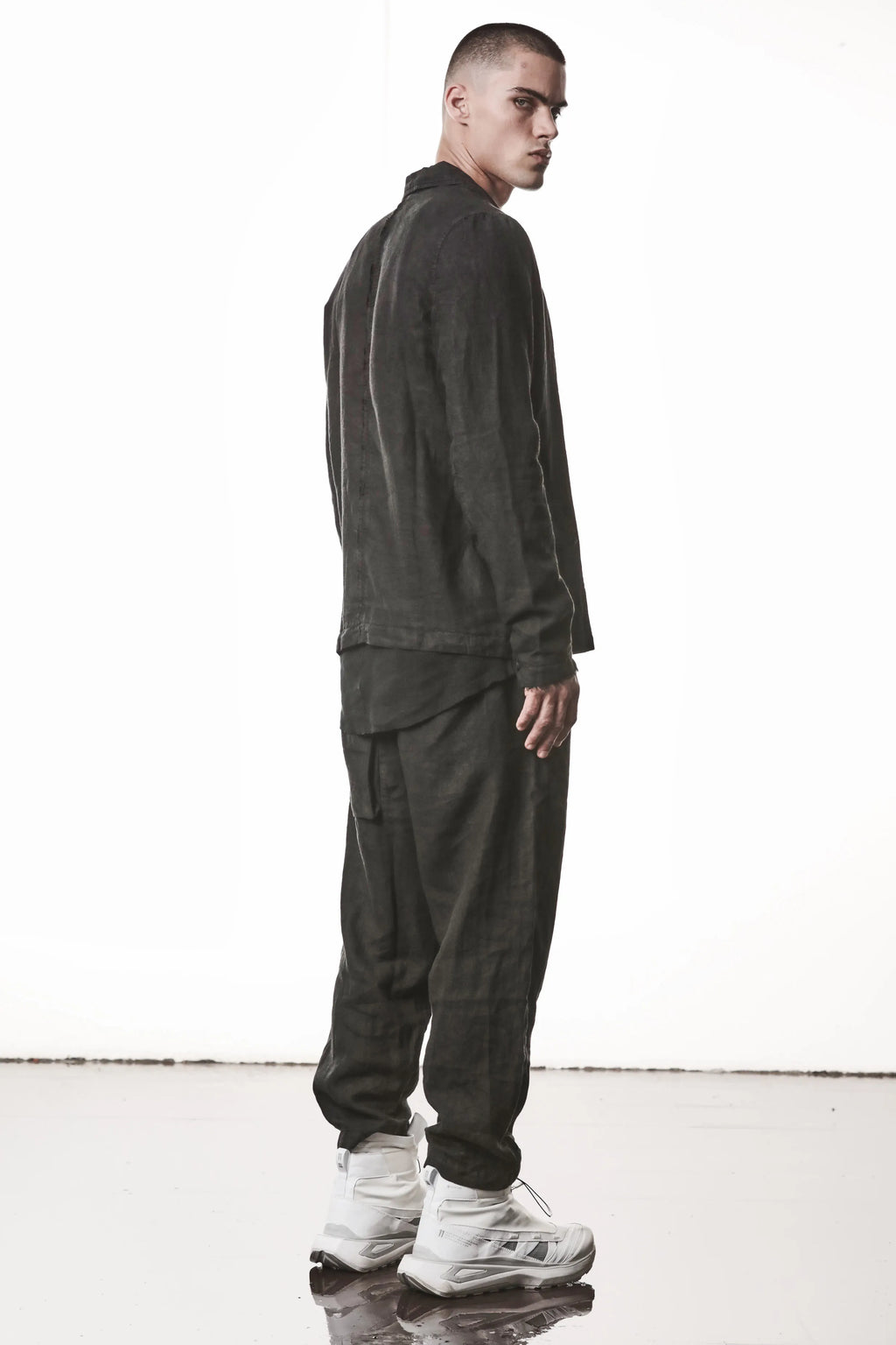 Thom Krom, Mens Blazer, Black, 100% Linen Shell, Cotton & Polyester/Viscose Linings, 3-button closure, Flap Pockets, Hidden Inner Pockets, Relaxed Detailing, Woven Fabric, Full Body Back 3/4 View. 