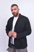 Thom Krom, Mens Blazer, Black, Buttons, V-Neck, Collar, Patch Pockets, Long Sleeves, White T-Shirt, Side Pockets, Slit in Back, Woven, Front View Hands in Front. 