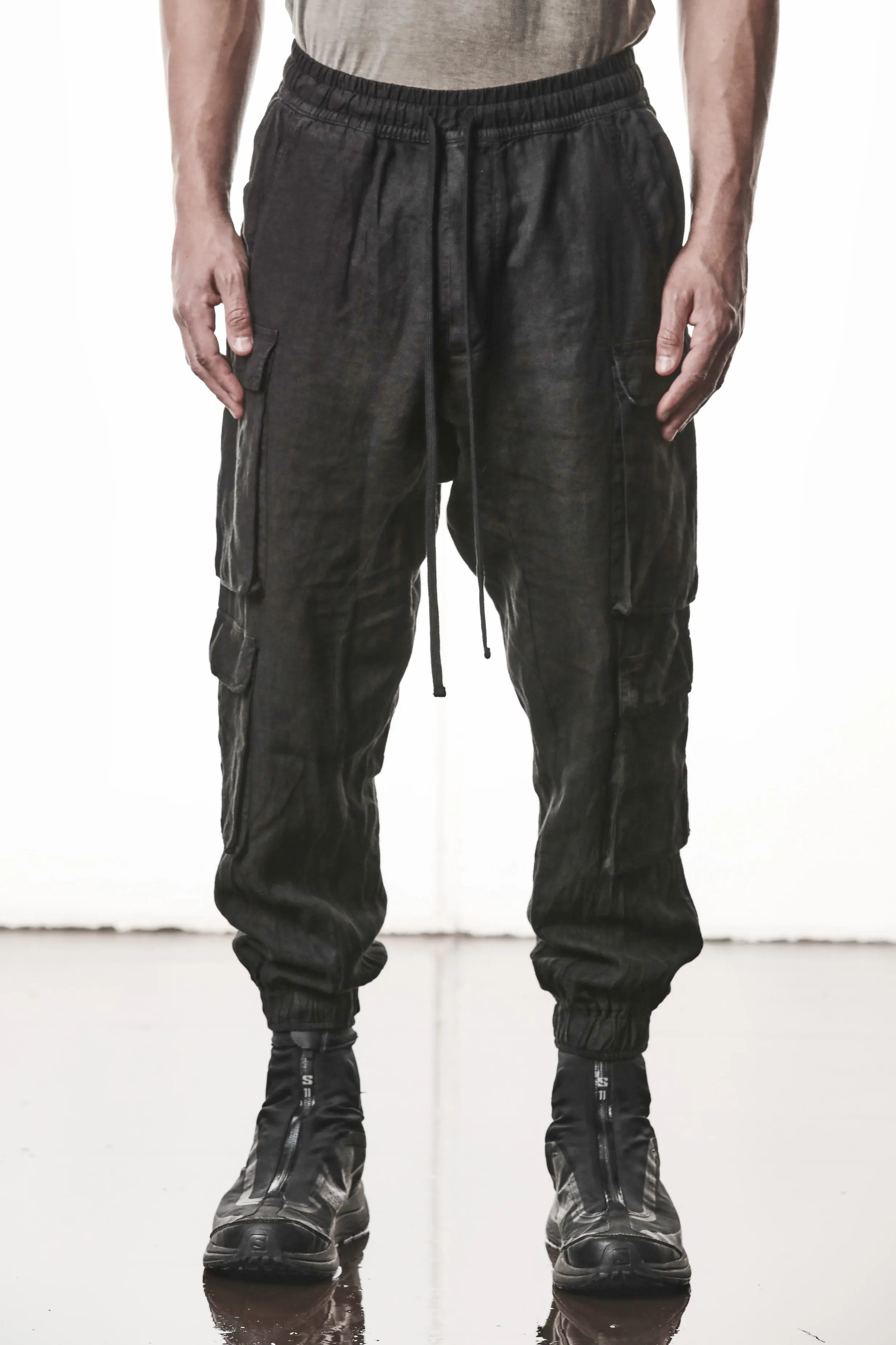 Thom Krom, Mens Pants, Black, Linen, Elasticated Waistband and Cuffs, Low-Crotch Trousers, Cargo Details, Black Drawstring, Side Pockets, Back Pockets, Front View. 