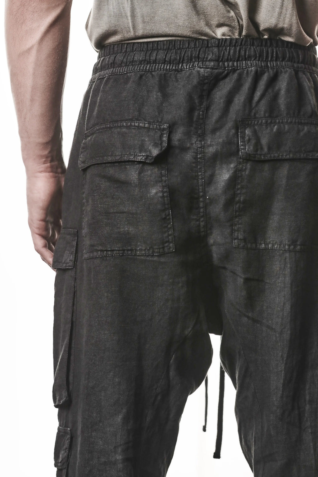 Thom Krom, Mens Pants, Black, Linen, Elasticated Waistband and Cuffs, Low-Crotch Trousers, Cargo Details, Black Drawstring, Side Pockets, Back Pockets, Back Flap Pockets Close-up. 