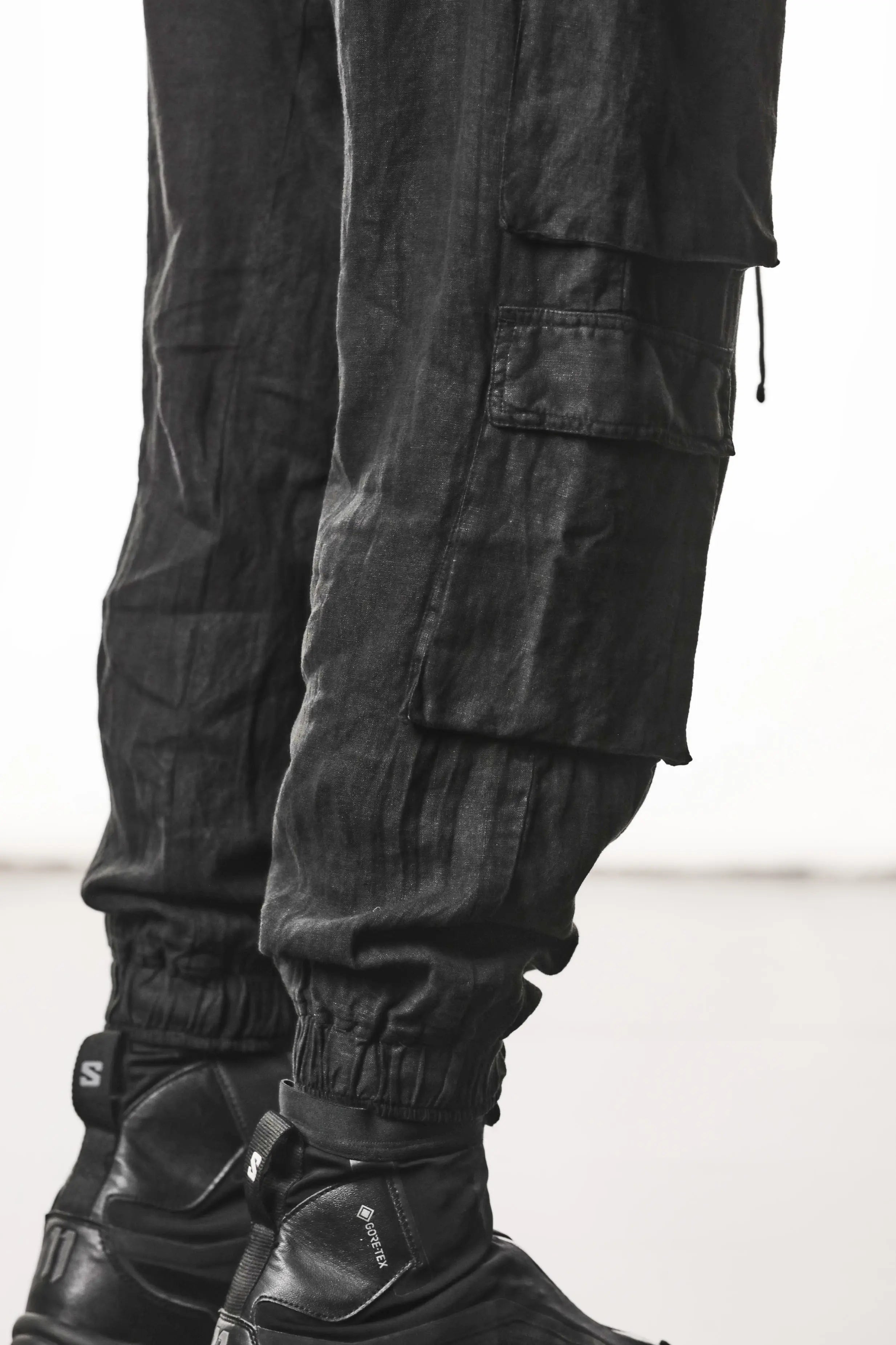 Thom Krom, Mens Pants, Black, Linen, Elasticated Waistband and Cuffs, Low-Crotch Trousers, Cargo Details, Black Drawstring, Side Pockets, Back Pockets, Side Cargo Details Showcase. 