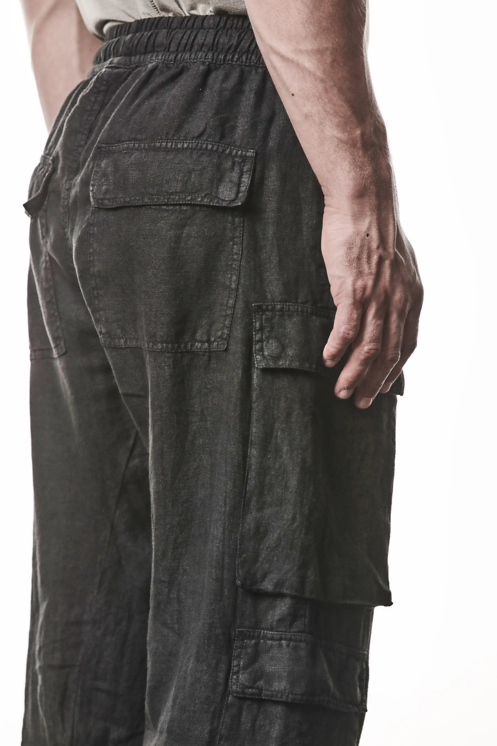 Thom Krom, Mens Pants, Black, Linen, Elasticated Waistband and Cuffs, Low-Crotch Trousers, Cargo Details, Black Drawstring, Side Pockets, Back Pockets, Back 3/4 View Close-up. 