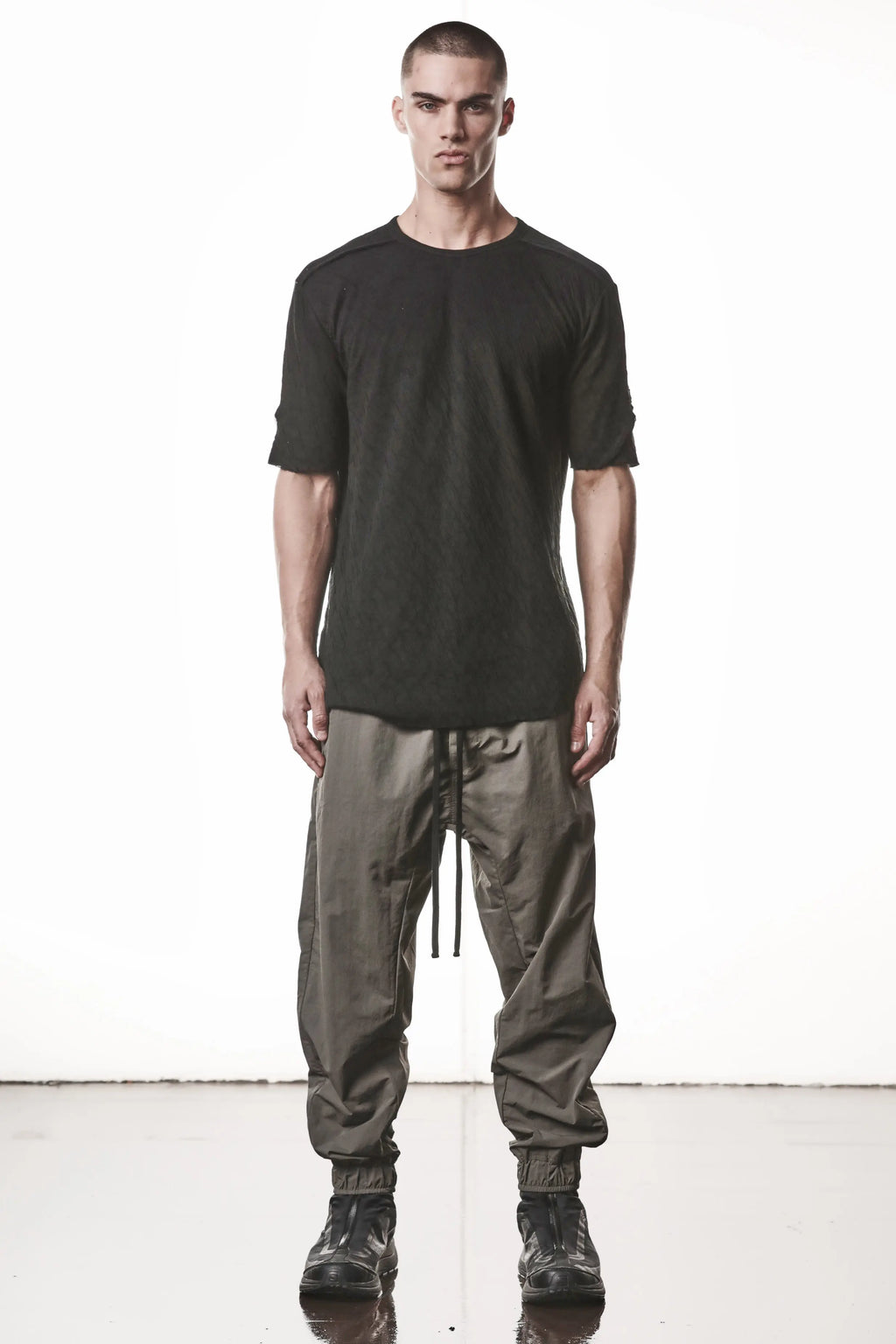 Thom Krom T-Shirt,Mens T-Shirt,Black Cotton,Raw Cut Hem,Raw Cut Sleeves,Round Crewneck,Slim Fit,Lightweight Crashed Bonded Cotton, Signature Front Level Shoulder Seams,Asymetric Sleeve Seams,Whole Body Photo