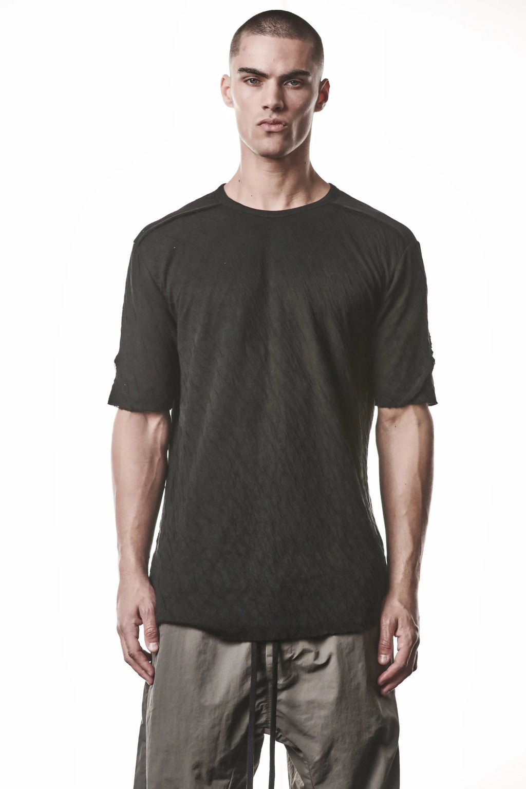 Thom Krom T-Shirt,Mens T-Shirt,Black Cotton,Raw Cut Hem,Raw Cut Sleeves,Round Crewneck,Slim Fit, Lightweight Crashed Bonded Cotton, Signature Front Level Shoulder Seams,Asymetric Sleeve Seams,Upper Body Photo
