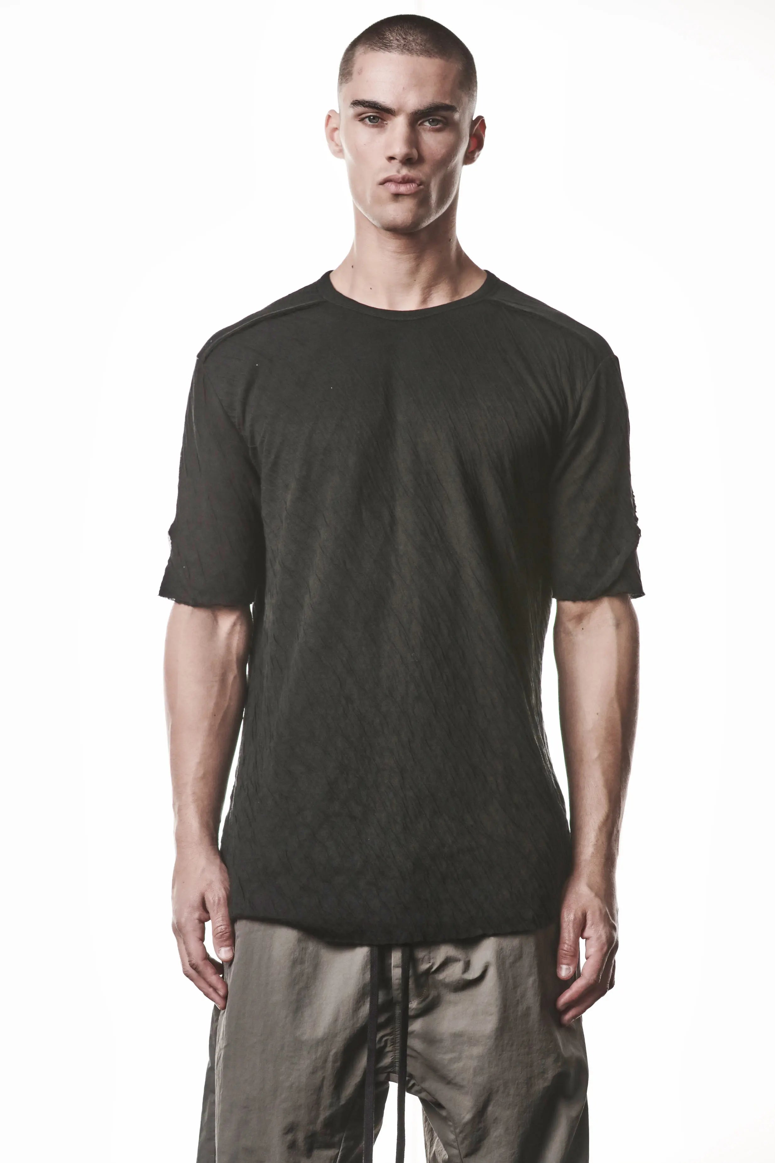 Thom Krom T-Shirt,Mens T-Shirt,Black Cotton,Raw Cut Hem,Raw Cut Sleeves,Round Crewneck,Slim Fit, Lightweight Crashed Bonded Cotton, Signature Front Level Shoulder Seams,Asymetric Sleeve Seams,Upper Body Photo