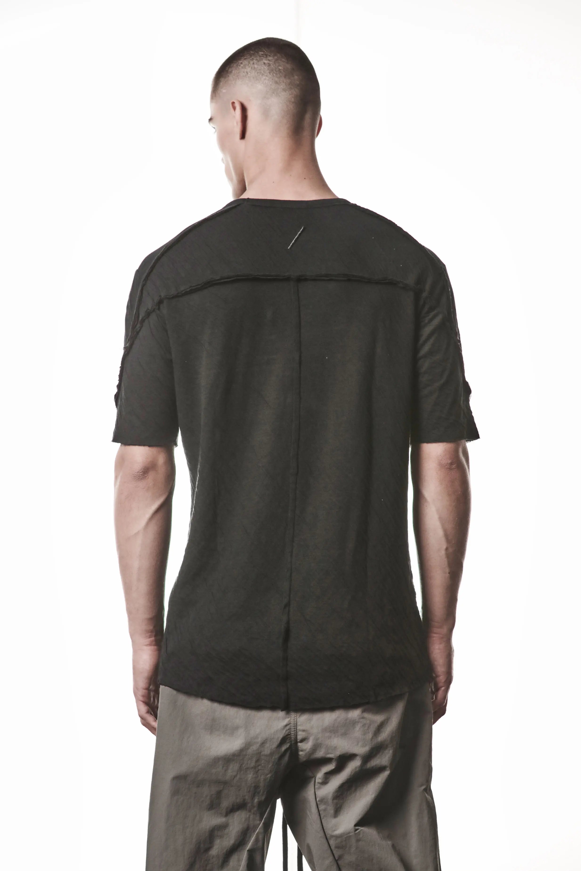 Thom Krom T-Shirt,Mens T-Shirt,Black Cotton,Raw Hem,Raw Sleeve Hem,Logo Embroidery On The Back,Signature Back Seam,Lightweight Crashed Bonded Cotton,Round Crewneck ,Standart Lenght,Slim Fit,Аsymmetrical Sleeve Seam , Backside Close up Photo