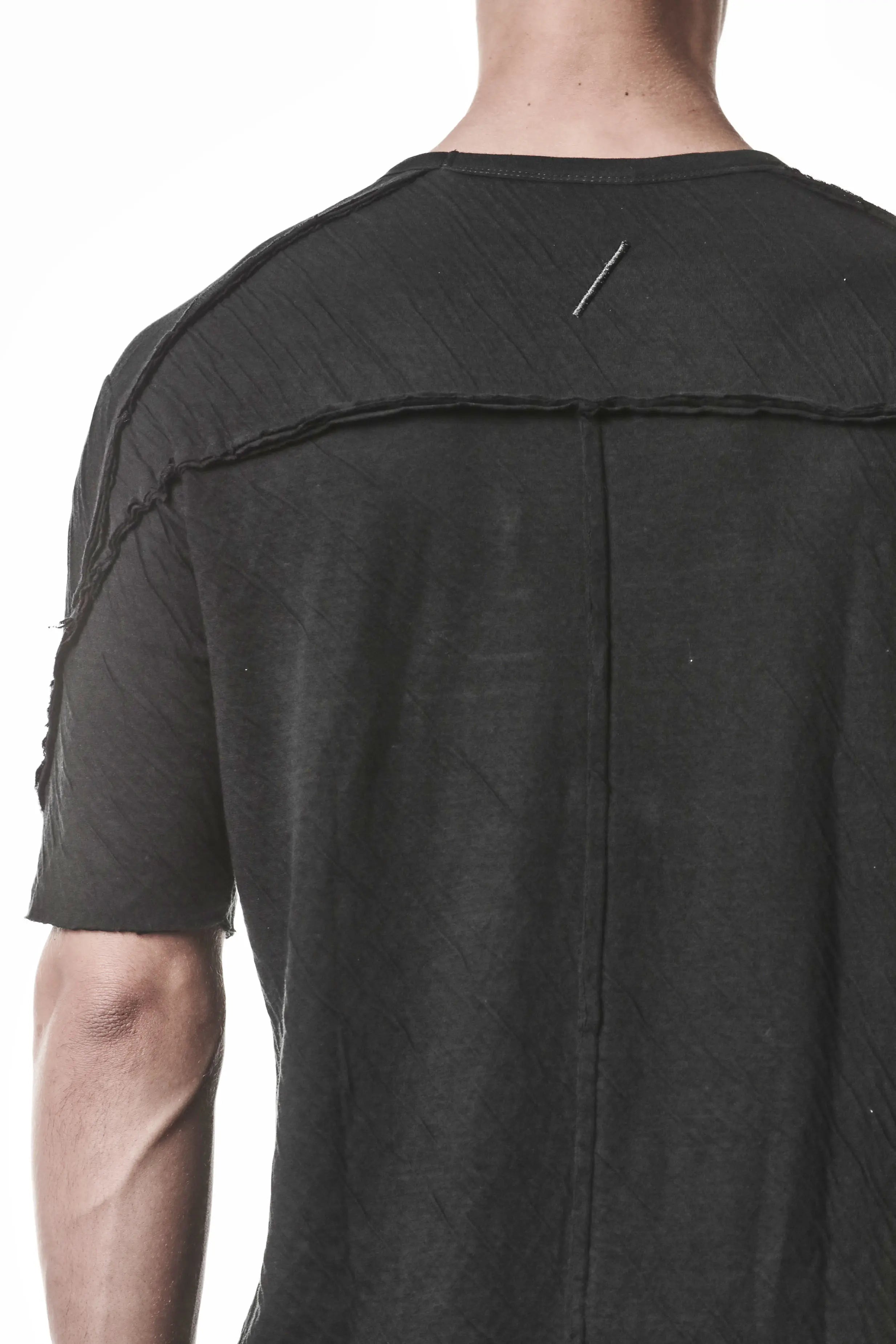 Thom Krom T-Shirt,Mens T-Shirt,Black  Cotton,Logo Embroidery On The Back,Signature Back Seam,Raw Sleeve Hem,Round Crewneck,Аsymmetrical Sleeve Seam,Lightweight Crashed Bonded Cotton,Backside Close up Photo