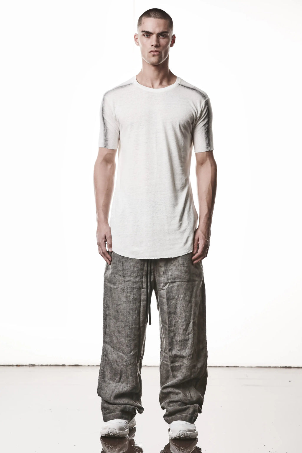 Thom Krom T-Shirt , Mens T-Shirt , Off White Cotton , Raw Cut Hem , Raw Cut Sleeves , Round Crewneck , Slim Fit , Standart Lenght , Full Length Photo , Signature Front Level  Shoulders Seams , Vertical Curved Dark Stiching Lines , Linen , Viscose , Cotton