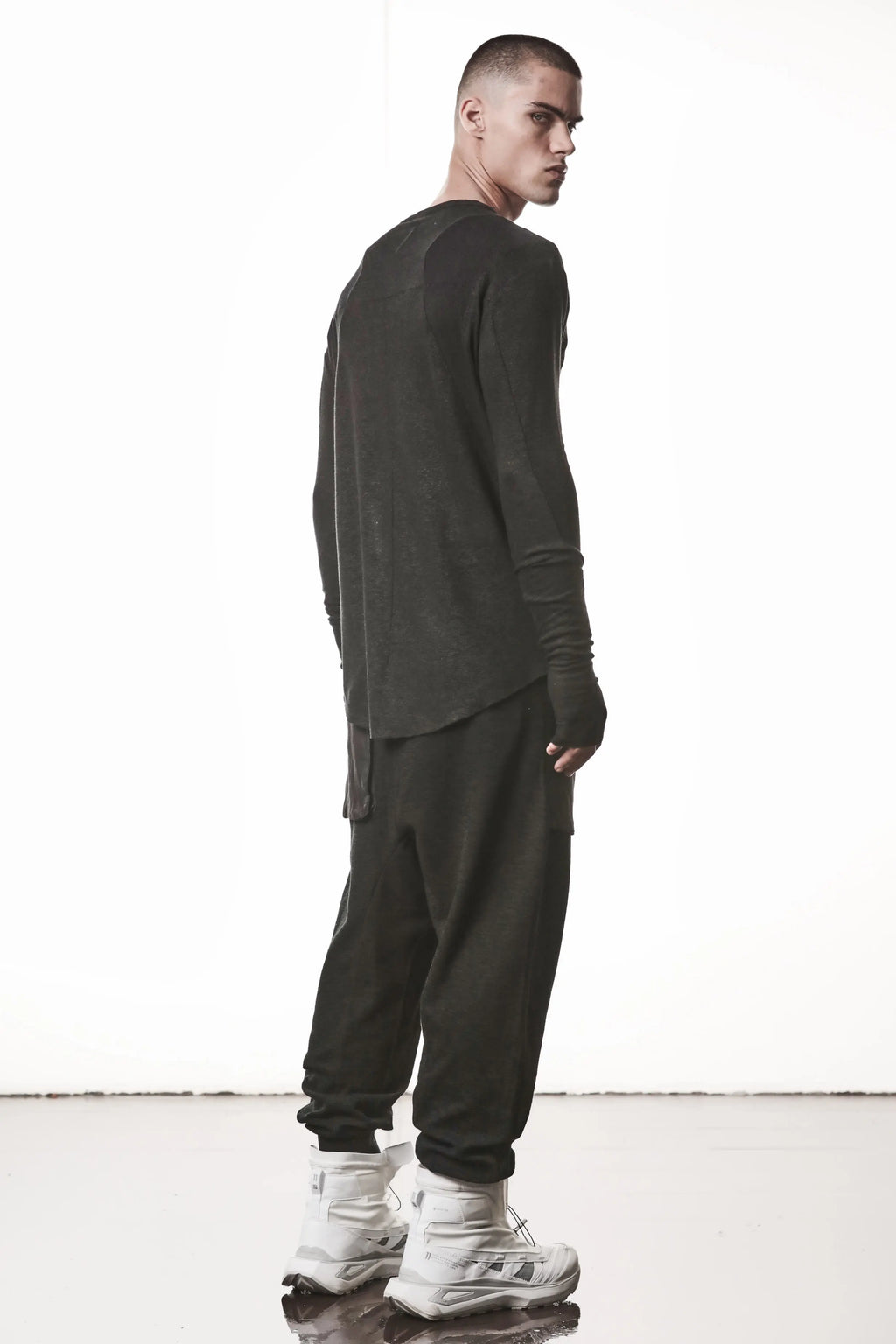 Thom Krom T-Shirt,Mens T-Shirt,Black Cotton,Linen,Viscose,Logo Embroidery,Signature Back Seam, Round Crewneck ,Standard Length, Paneled Construction,Аsymmetrical Sleeve Seam,Extended Sleeves,Curved Hem Line,Extended Sleeves With Thumbhole Details,Side Angle Whole Body Photo