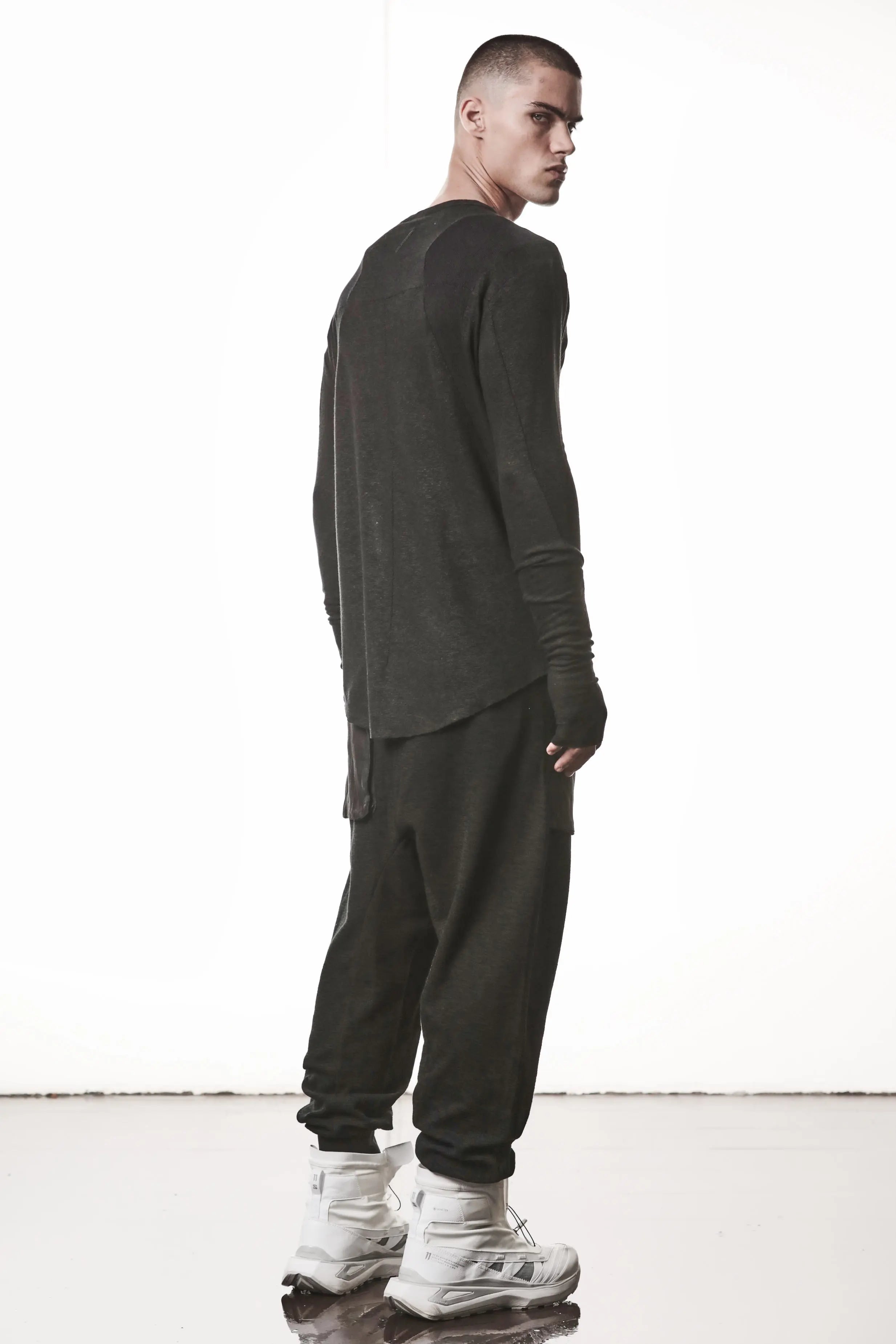 Thom Krom T-Shirt,Mens T-Shirt,Black Cotton,Linen,Viscose,Logo Embroidery,Signature Back Seam, Round Crewneck ,Standard Length, Paneled Construction,Аsymmetrical Sleeve Seam,Extended Sleeves,Curved Hem Line,Extended Sleeves With Thumbhole Details,Side Angle Whole Body Photo