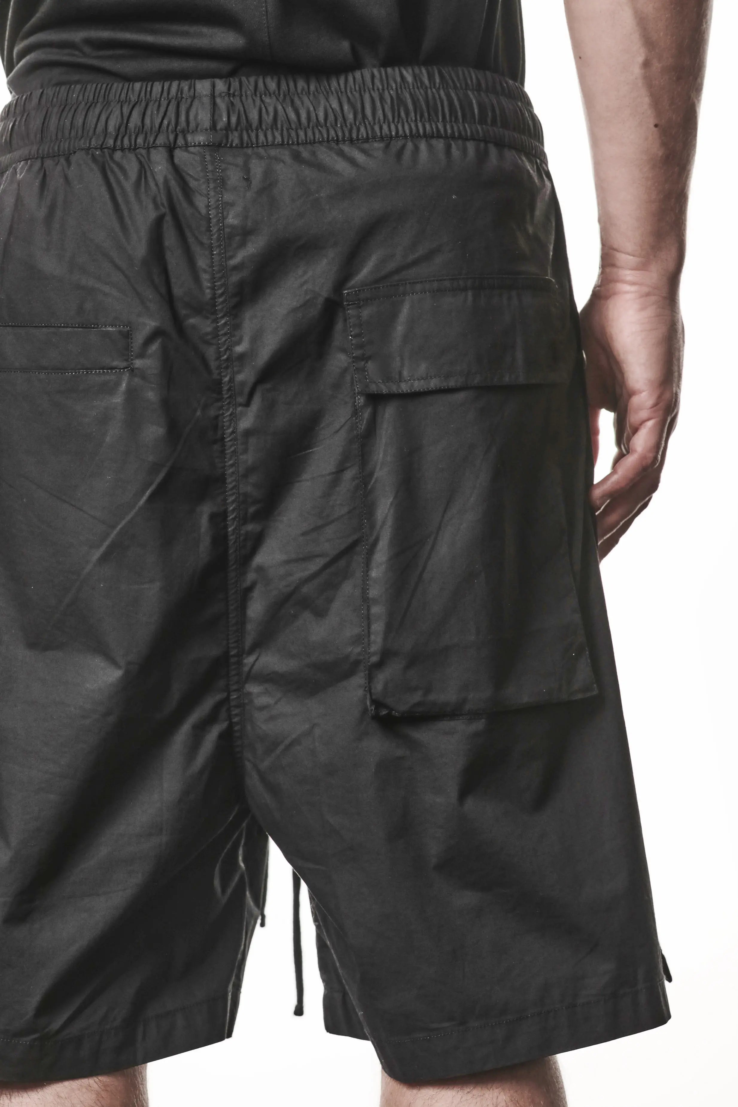 Thom Krom, Mens Shorts, Black, Over the Knee, Elasticated Waistband, Black Drawstring, Cargo Pockets, Side Pockets, Wide-fit, Drop-crotch, Back Pockets Close-up. 