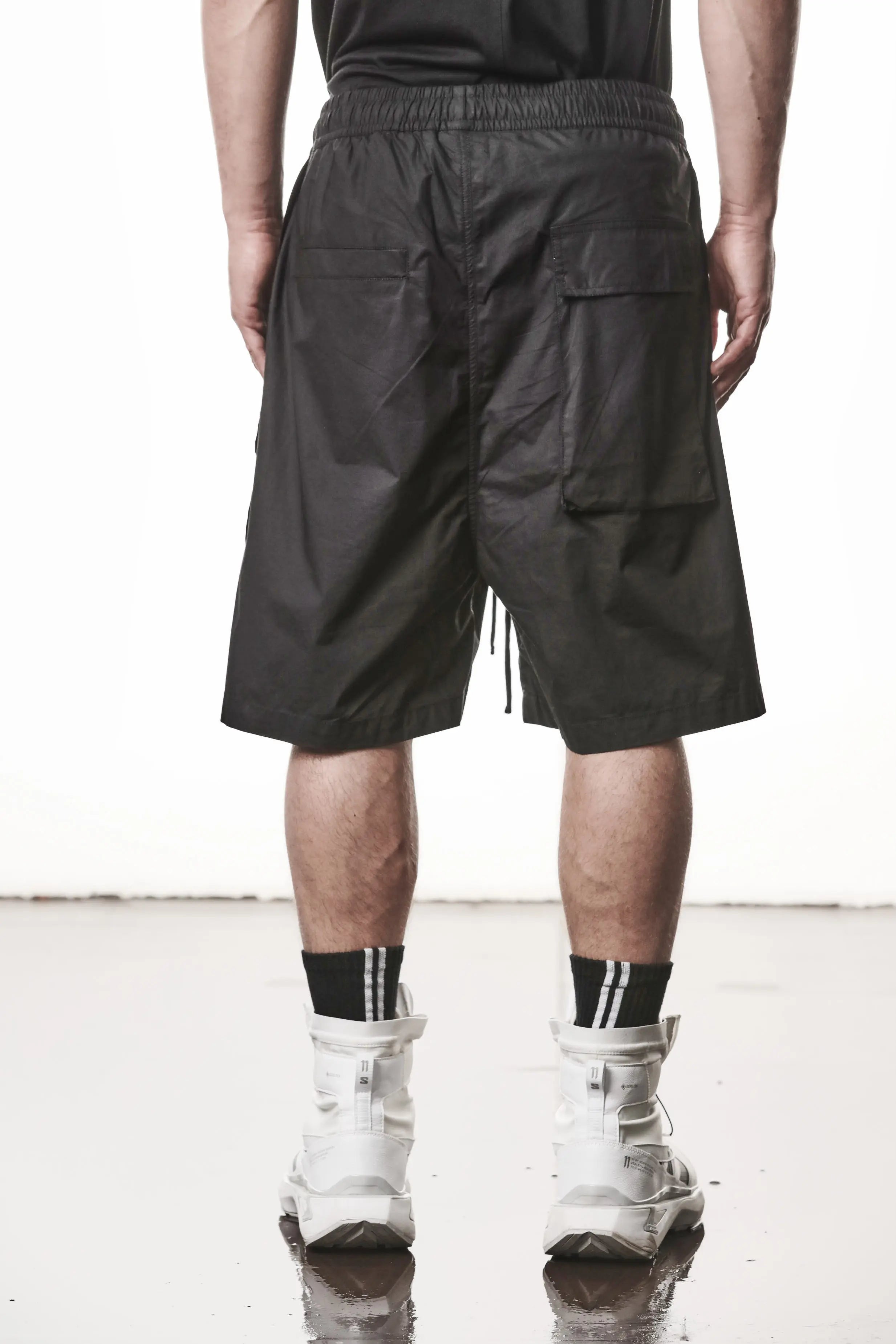Thom Krom, Mens Shorts, Black, Over the Knee, Elasticated Waistband, Black Drawstring, Cargo Pockets, Side Pockets, Wide-fit, Drop-crotch, Back View. 