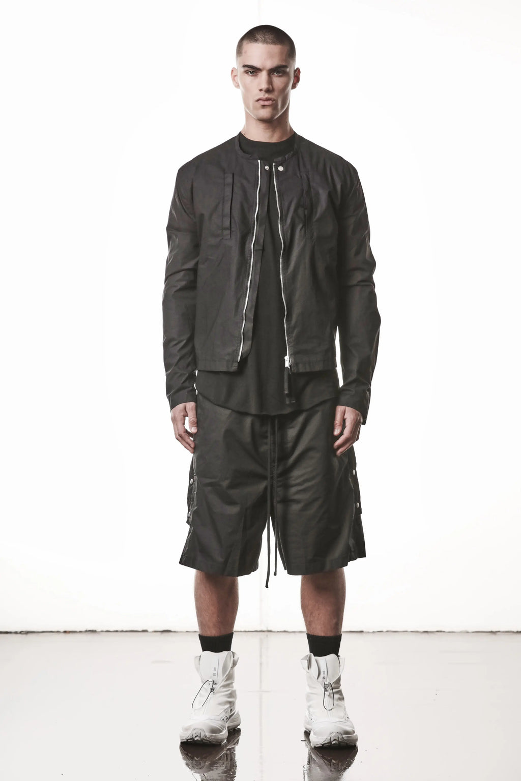 Thom Krom, Mens Shorts, Black, Over the Knee, Elasticated Waistband, Black Drawstring, Cargo Pockets, Side Pockets, Wide-fit, Drop-crotch, Full Body Front View. 